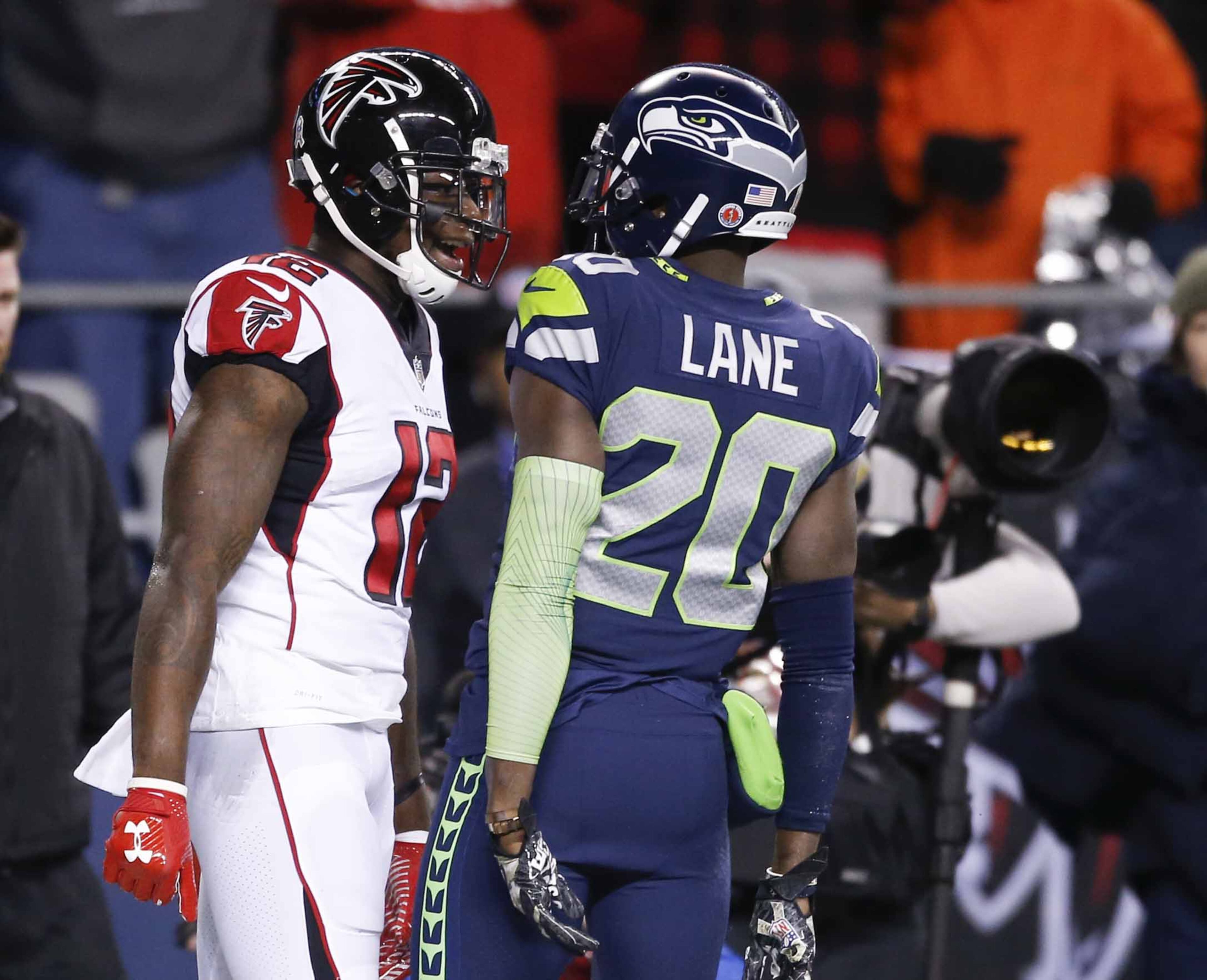 SEATTLE, WA - NOVEMBER 20: Wide receiver Mohamed Sanu #12 of the Atlanta Falcons and cornerback Jeremy Lane #20 of the Seattle Seahawks trade words after Lane was called for pass interference in the end zone in the first quarter of the game at CenturyLink Field on November 20, 2017 in Seattle, Washington. (Photo by Otto Greule Jr /Getty Images)