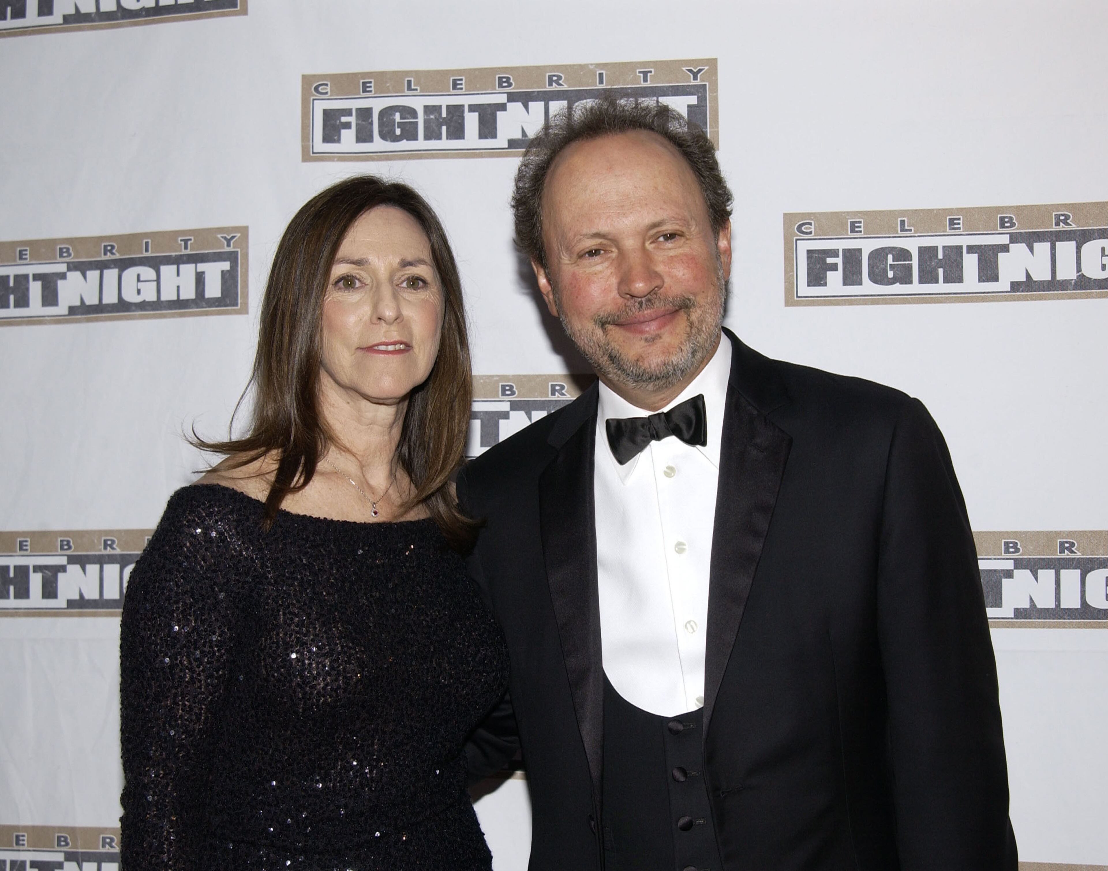Actor/producer/director Billy Crystal (R) and wife Janice Goldfinger attend "Celebrity Fight Night IX" fundraiser at the Arizona Biltmore Hotel on March 15, 2003 in Phoenix, Arizona. Celebrity Fight Night is a non-profit organization which raises money for several national research centers and charities. (Photo by Robert Mora/Getty Images)