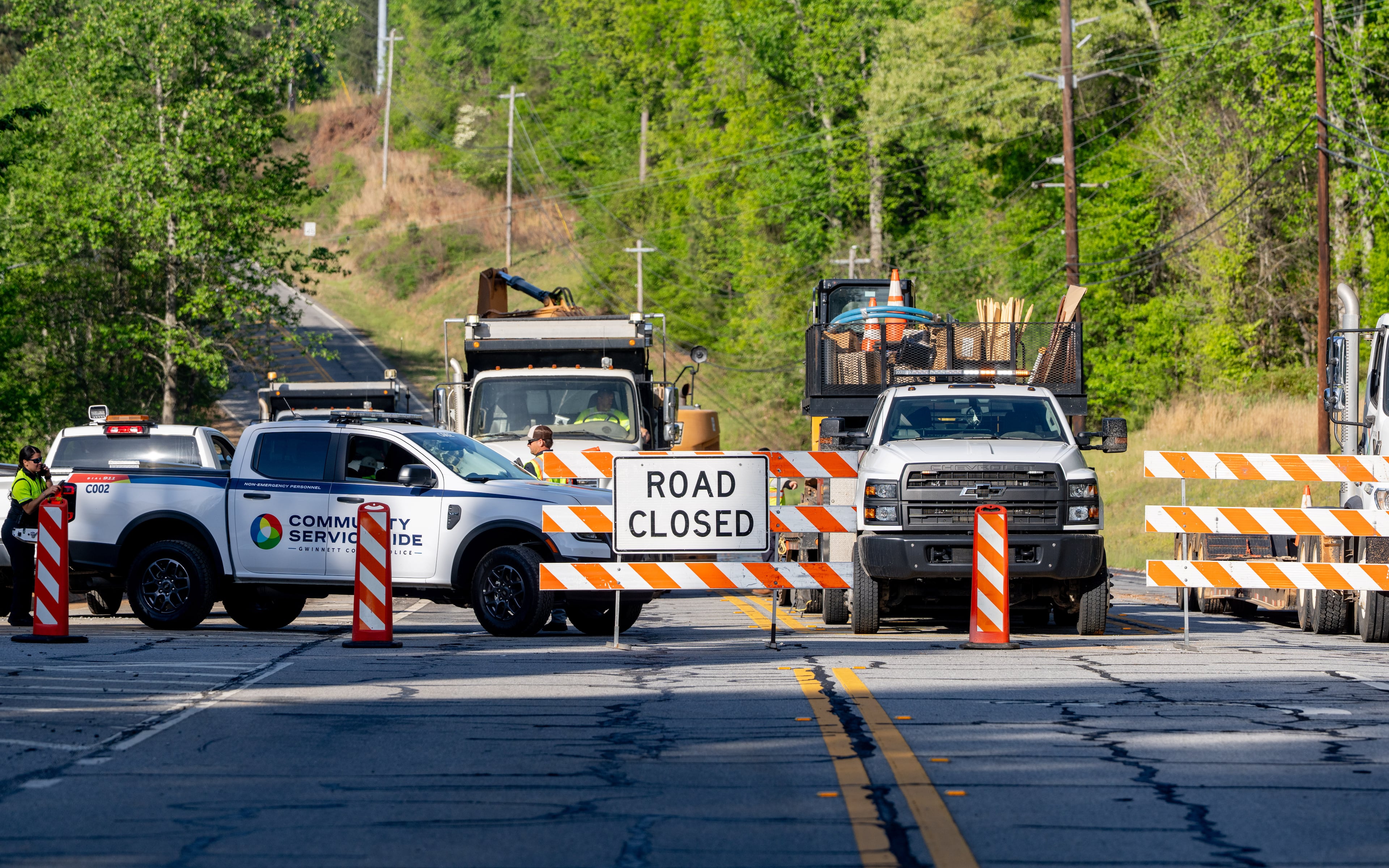 Buford Highway is closed at the intersection of Percival Drive on Tuesday, April 14, 2026. The road closure started just after 5 a.m. (Ben Hendren for the AJC)