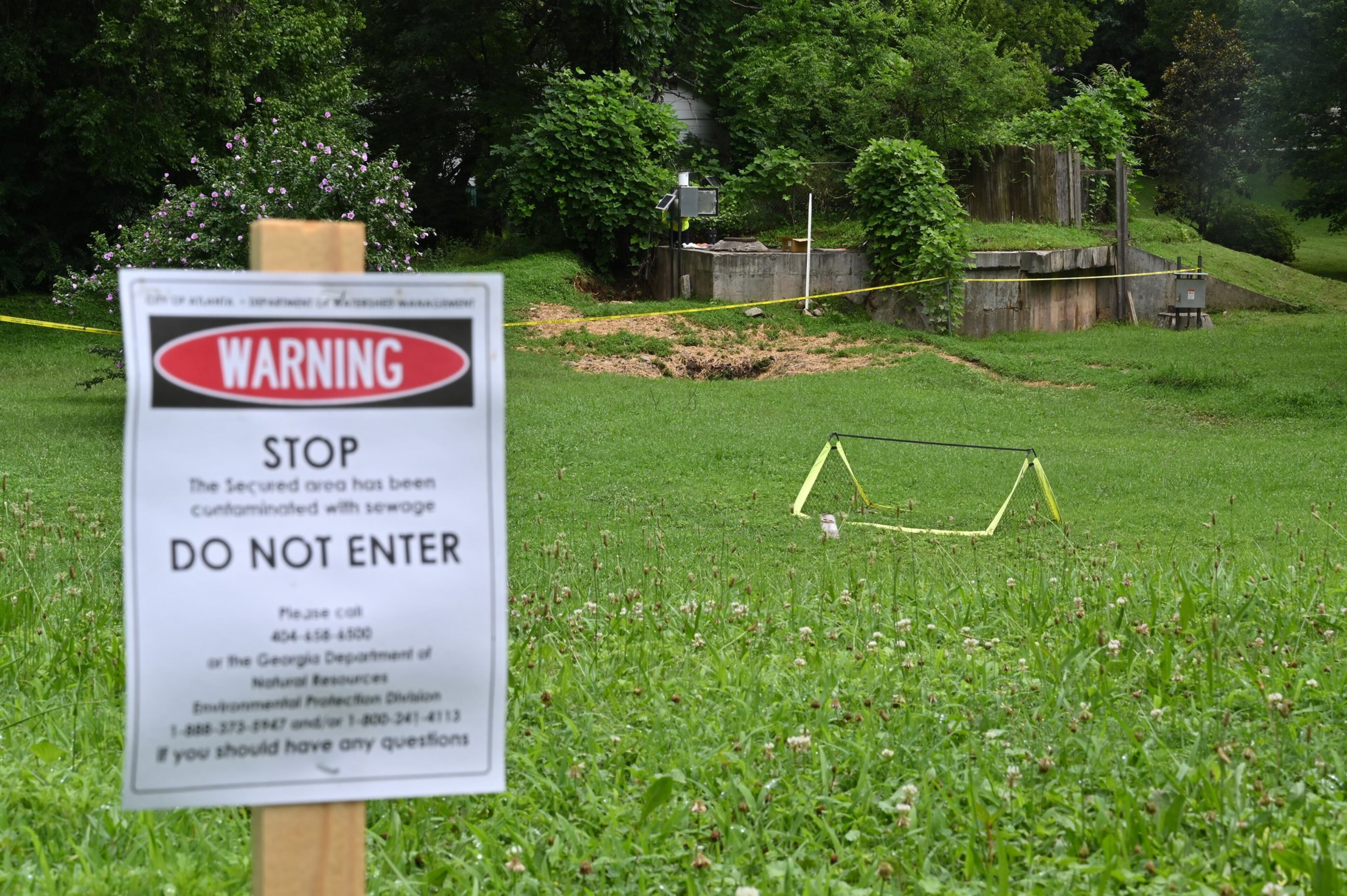 An area between Atlanta Avenue and Ormond Street near Greenfield Street is secured due to sewage contamination in Peoplestown on Tuesday, July 7, 2020, after recent flooding. HYOSUB SHIN / HYOSUB.SHIN@AJC.COM