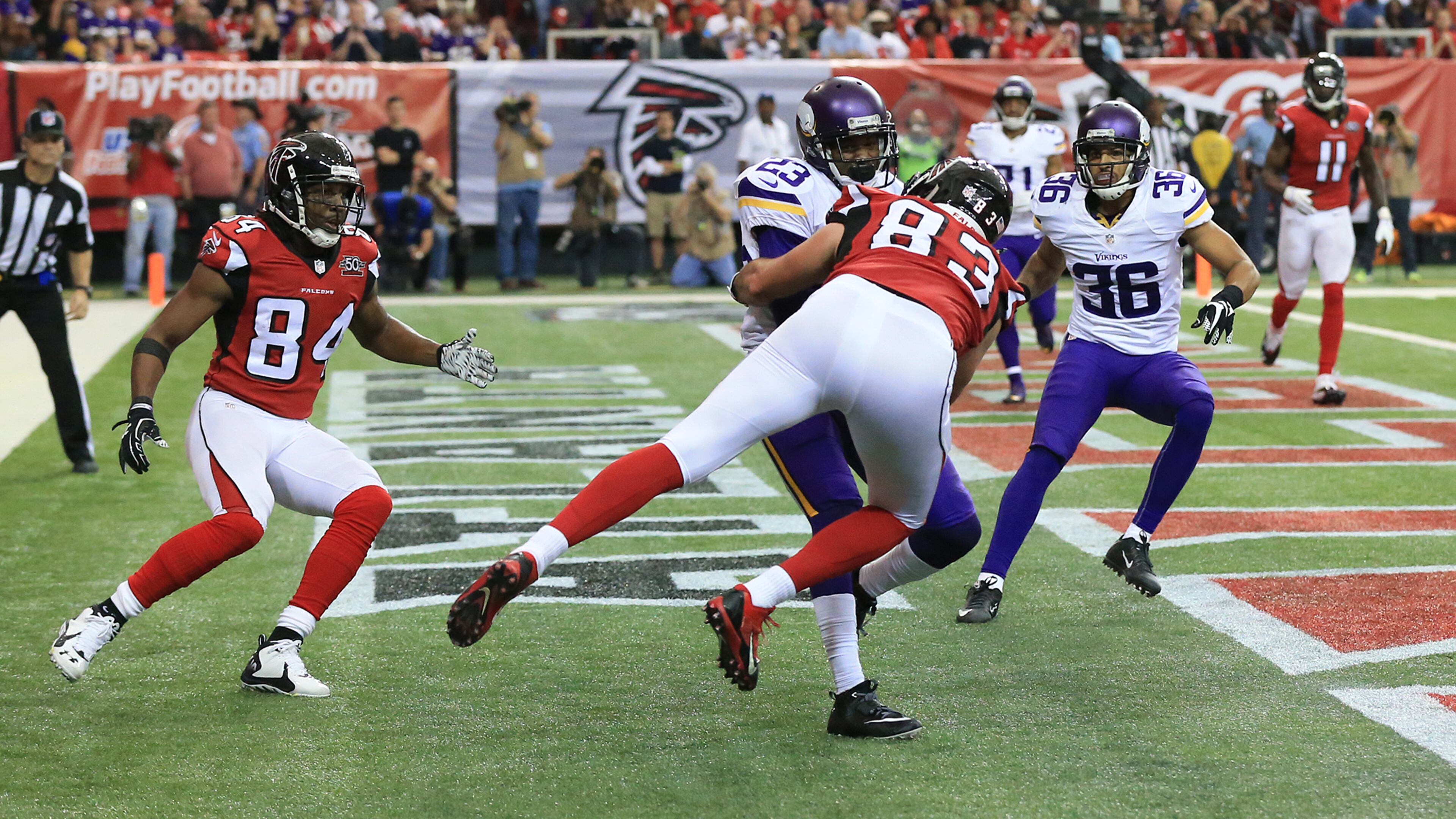 Vikings cornerback Terence Newman intercepts a pass from Falcons quarterback Matt Ryan in the endzone intended for wide receiver Roddy White (left) as tight end Jacob Tamme arrives late for the tackle during the third quarter in a football game on Sunday, Nov. 29, 2015, in Atlanta.