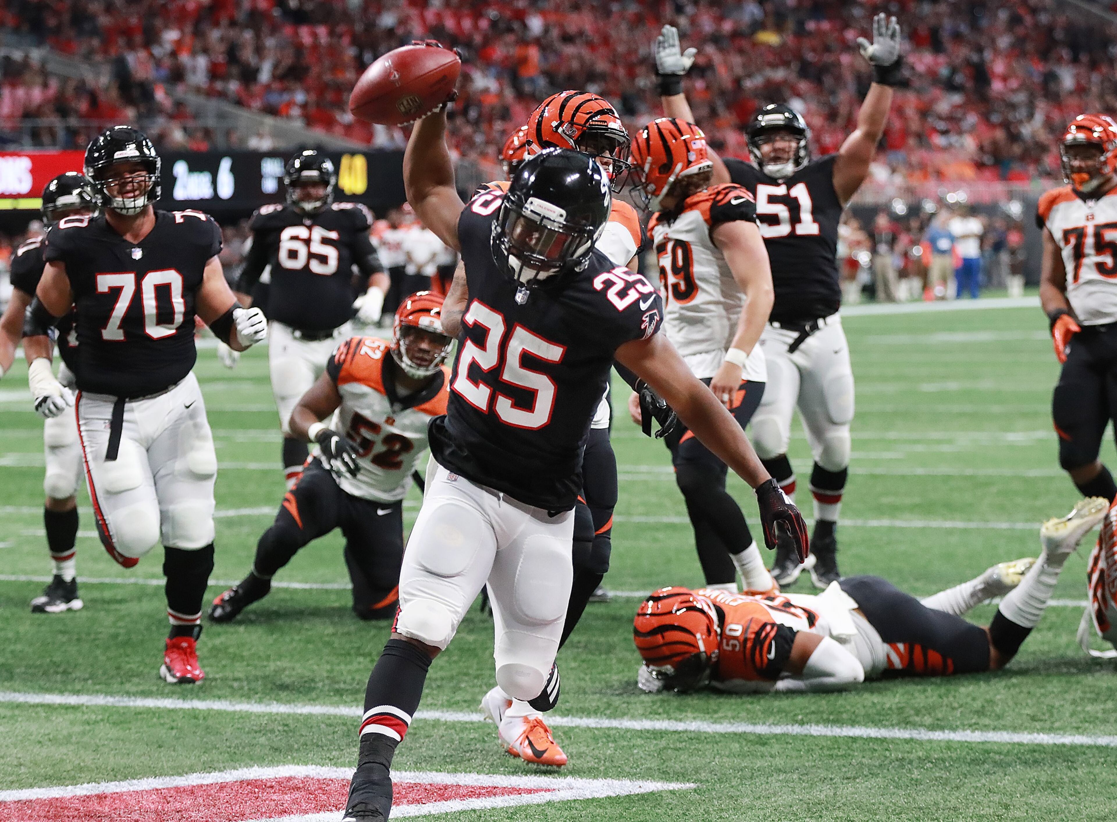 September 30, 2018 Atlanta: Falcons running back Ito Smith spikes the ball after scoring a touchdown for a 7-0 lead over the Bengals during the first quarter in a NFL football game on Sunday, Sept 30, 2018, in Atlanta. Curtis Compton/ccompton@ajc.com