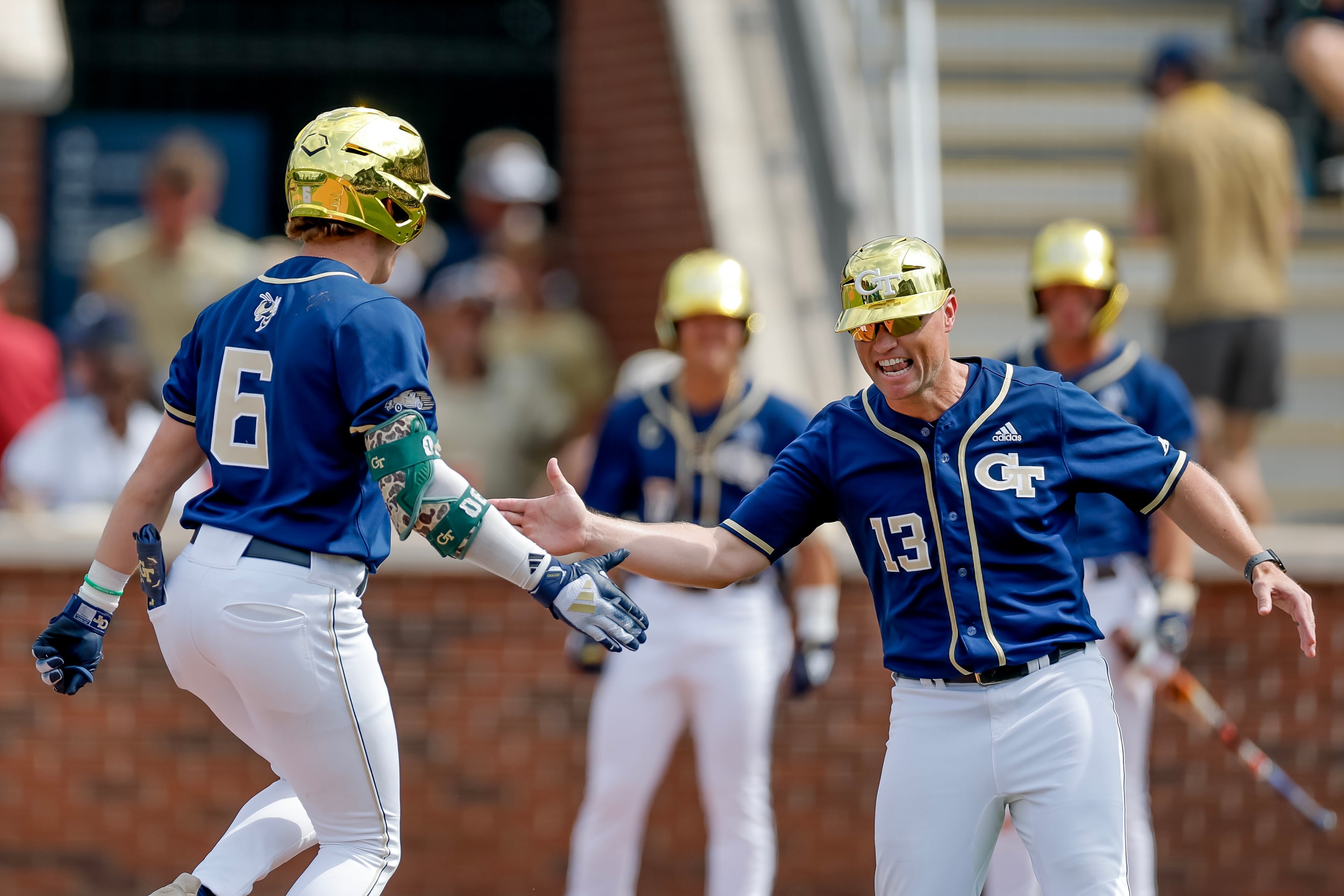 Georgia Tech head coach James Ramsey (right) celebrates with Tech's Caleb Daniel after a solo home run against Oklahoma during the fifth inning of the Atlanta Regional elimination baseball game at Russ Chandler Stadium on Monday, June 1, 2026. (Erik S. Lesser for the AJC)