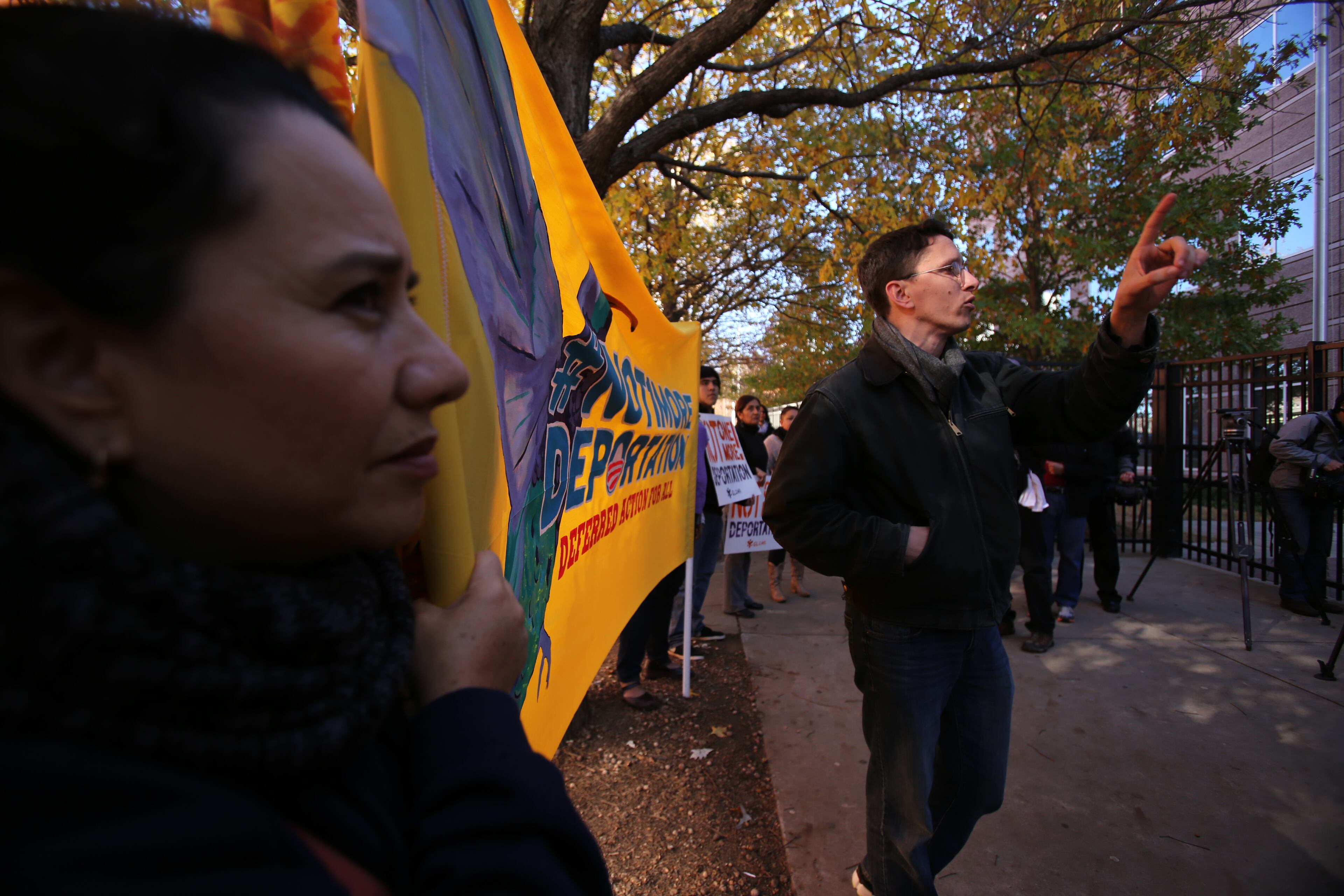 Activists locked themselves to the gates outside a federal government building in downtown Atlanta Tuesday as part of a boisterous demonstration against the Obama administration's immigration enforcement policies. Witnesses said authorities used bolt cutters to break the bicycle locks the activists used and took 14 people into custody just outside a building that houses U.S. Immigration and Customs Enforcement offices and federal immigration courtrooms.