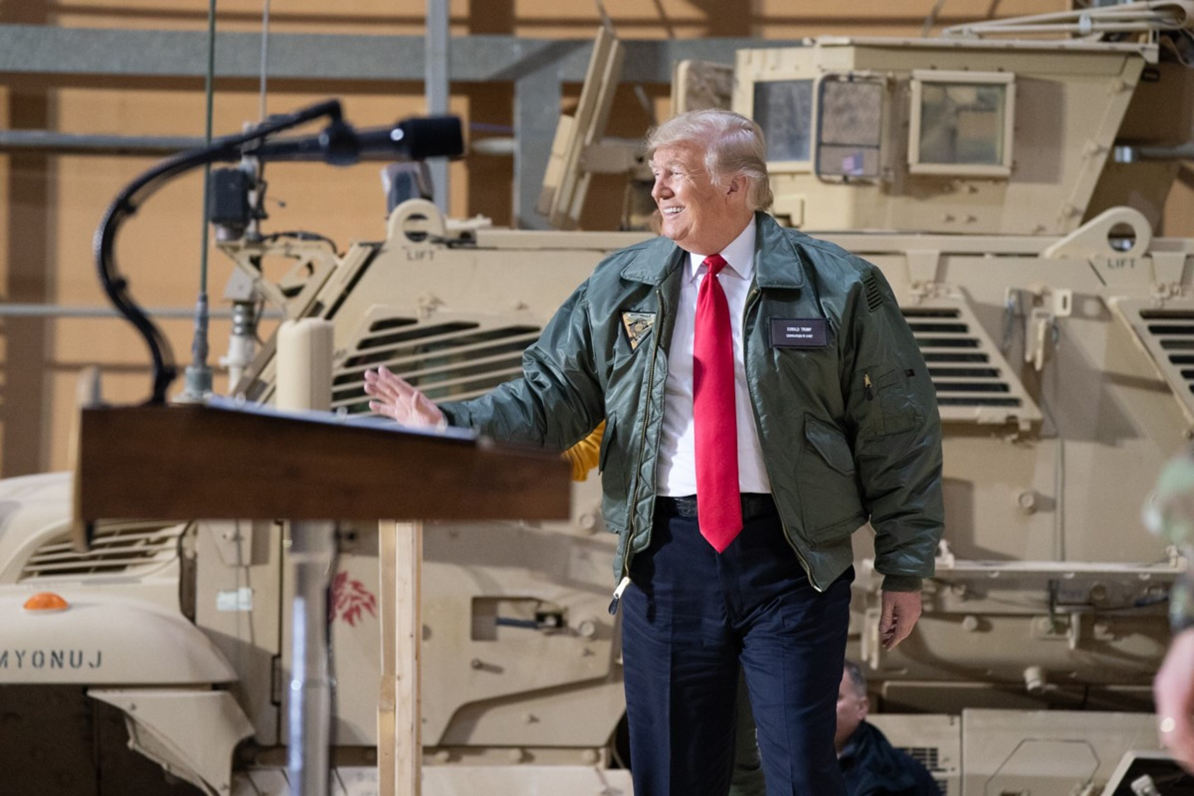 President Donald J. Trump, joined by First Lady Melania Trump, arrives on stage to addresses his remarks to U.S. troops Wednesday, December 26, 2018, at the Al-Asad Airbase in Iraq.