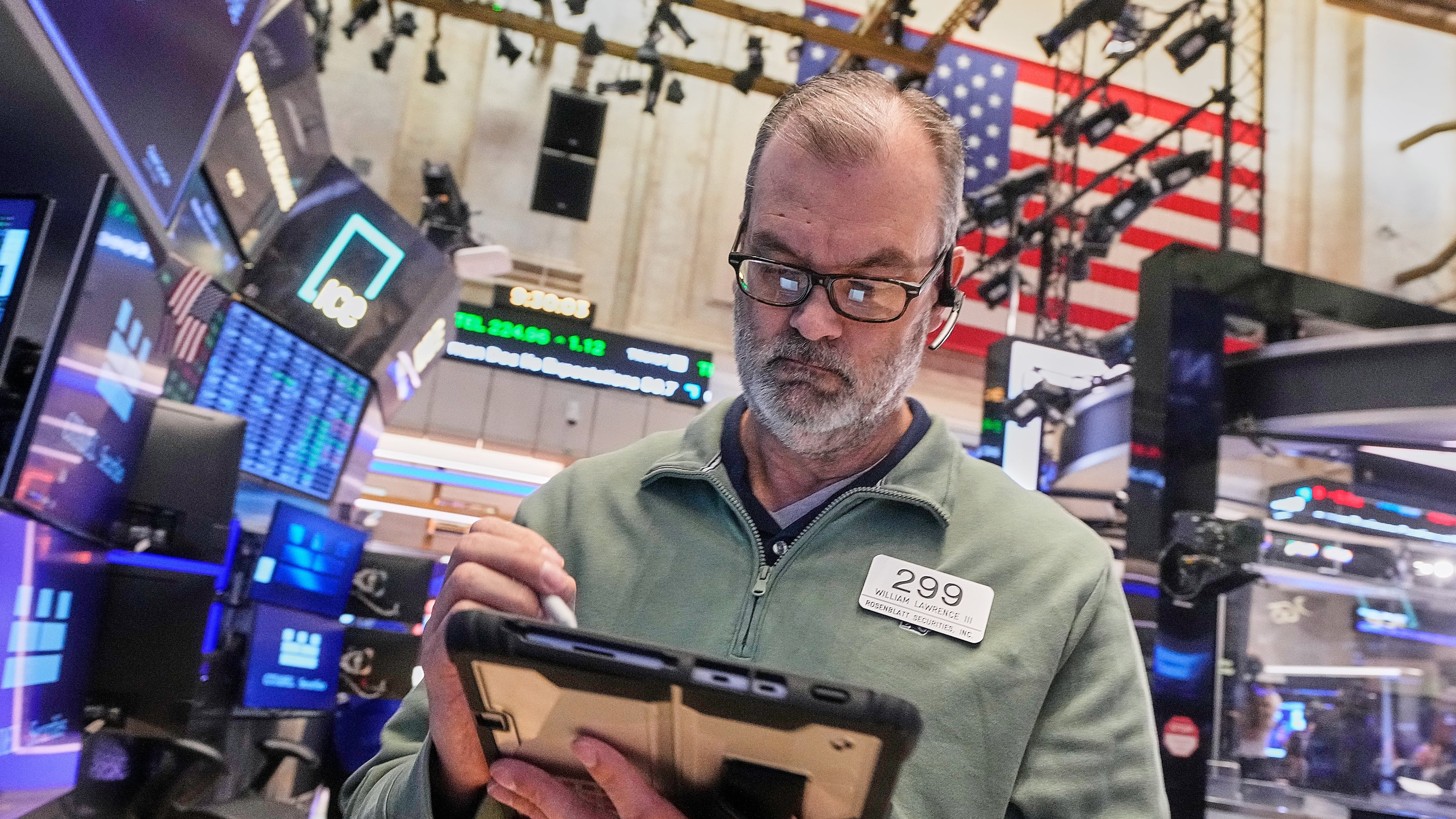 Trader William Lawrence works on the floor of the New York Stock Exchange, Monday, Jan. 26, 2026. (AP Photo/Richard Drew)