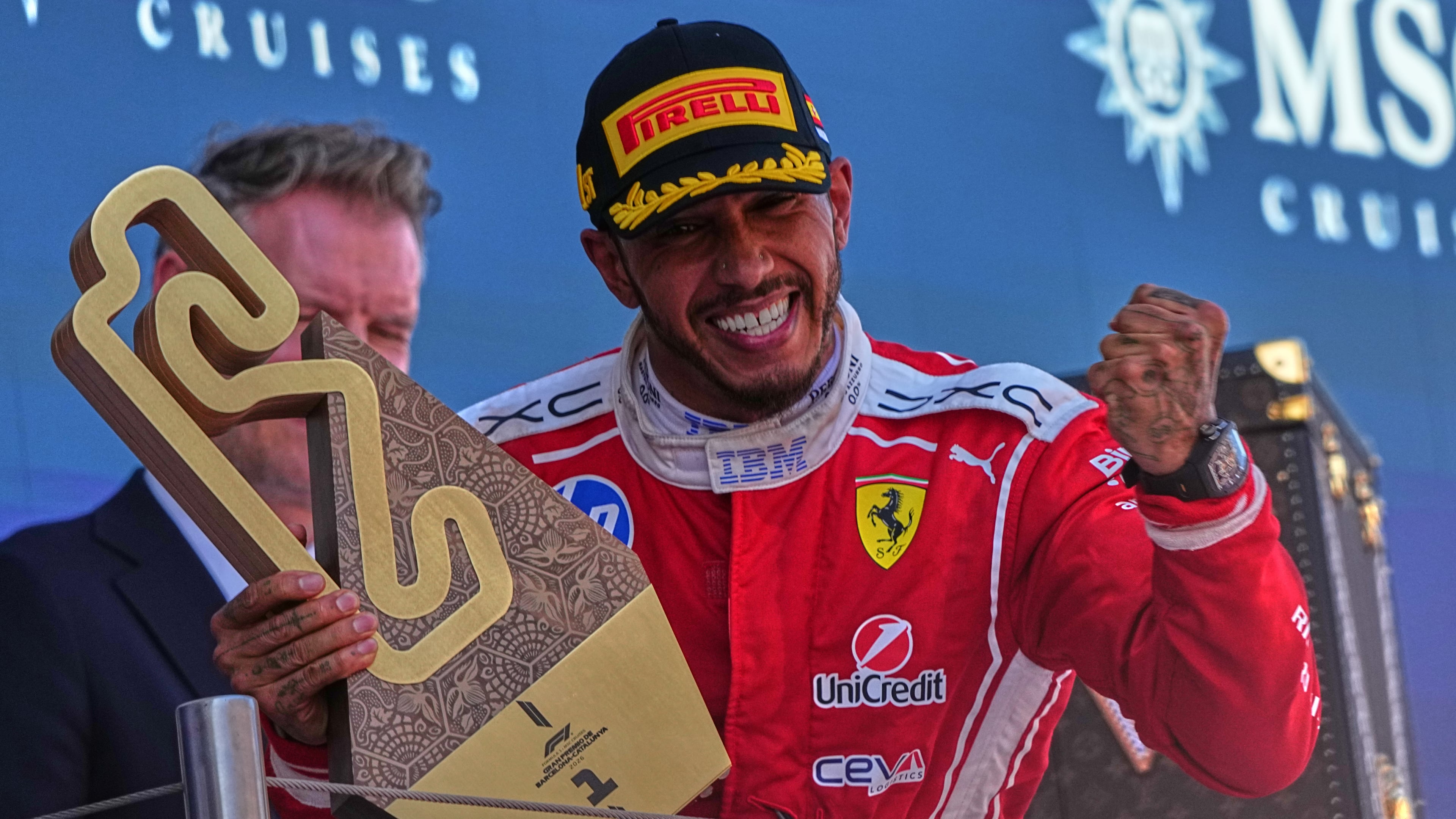 Ferrari driver Lewis Hamilton of Britain celebrates after wining the Spain F1 Grand Prix race at the Barcelona Catalunya racetrack in Montmelo, near Barcelona, Spain, Sunday, June 14, 2026. (AP Photo/Fatima Shbair)