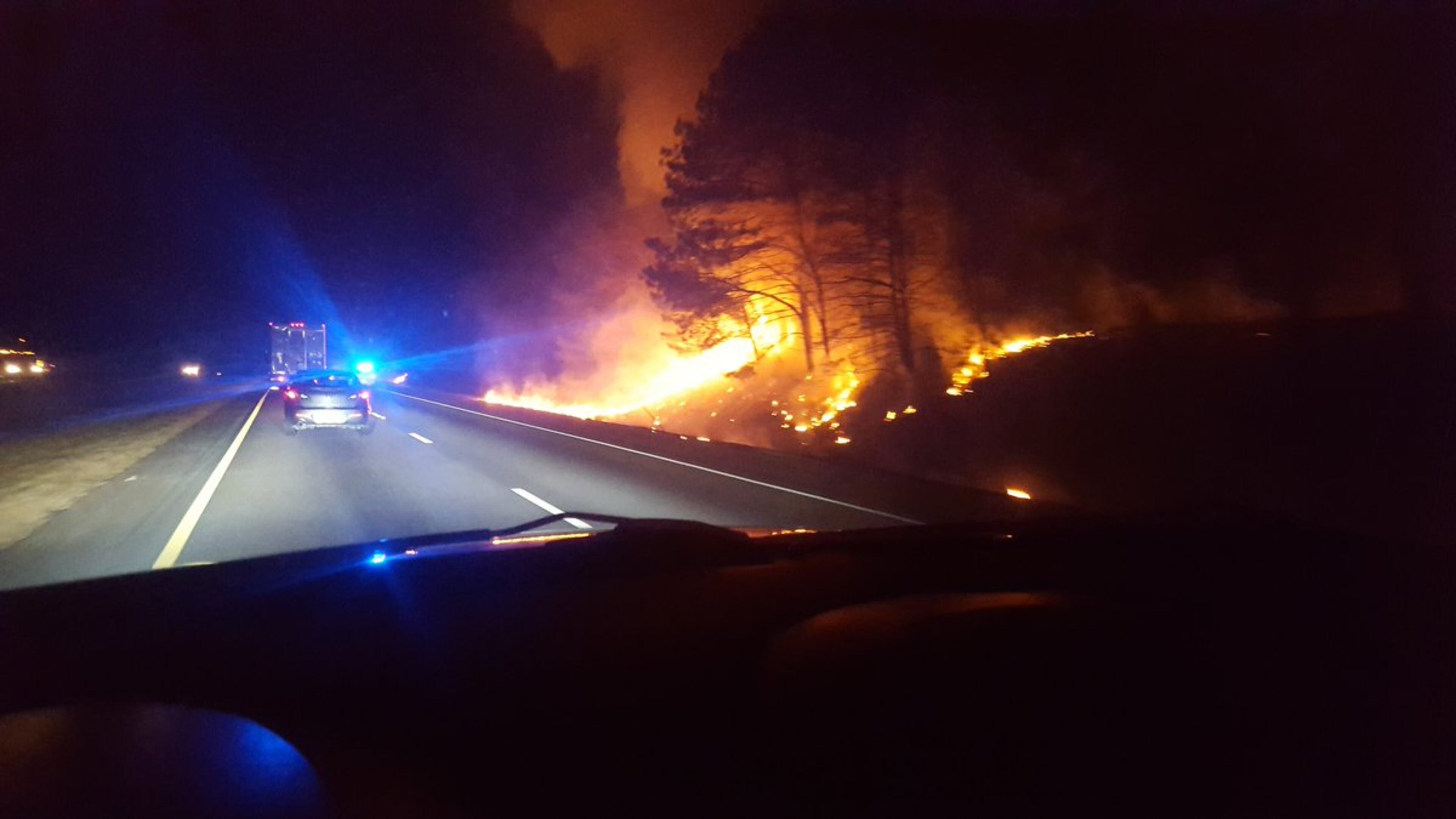 Huge flames could be seen early Wednesday on southbound I-85 before Hamilton Mill Road in Gwinnett County. (Credit: Nick Ellsworth)