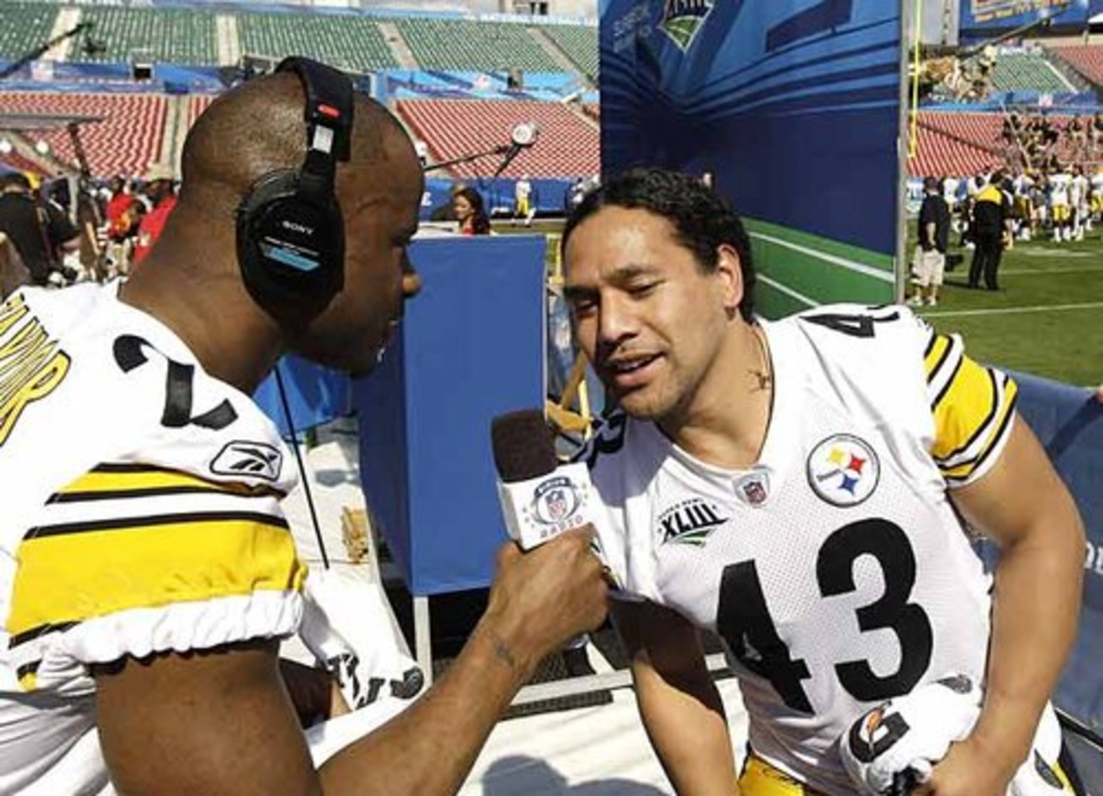 Steelers safety Troy Polamalu (right) takes "interview questions" from teammate Ike Taylor.