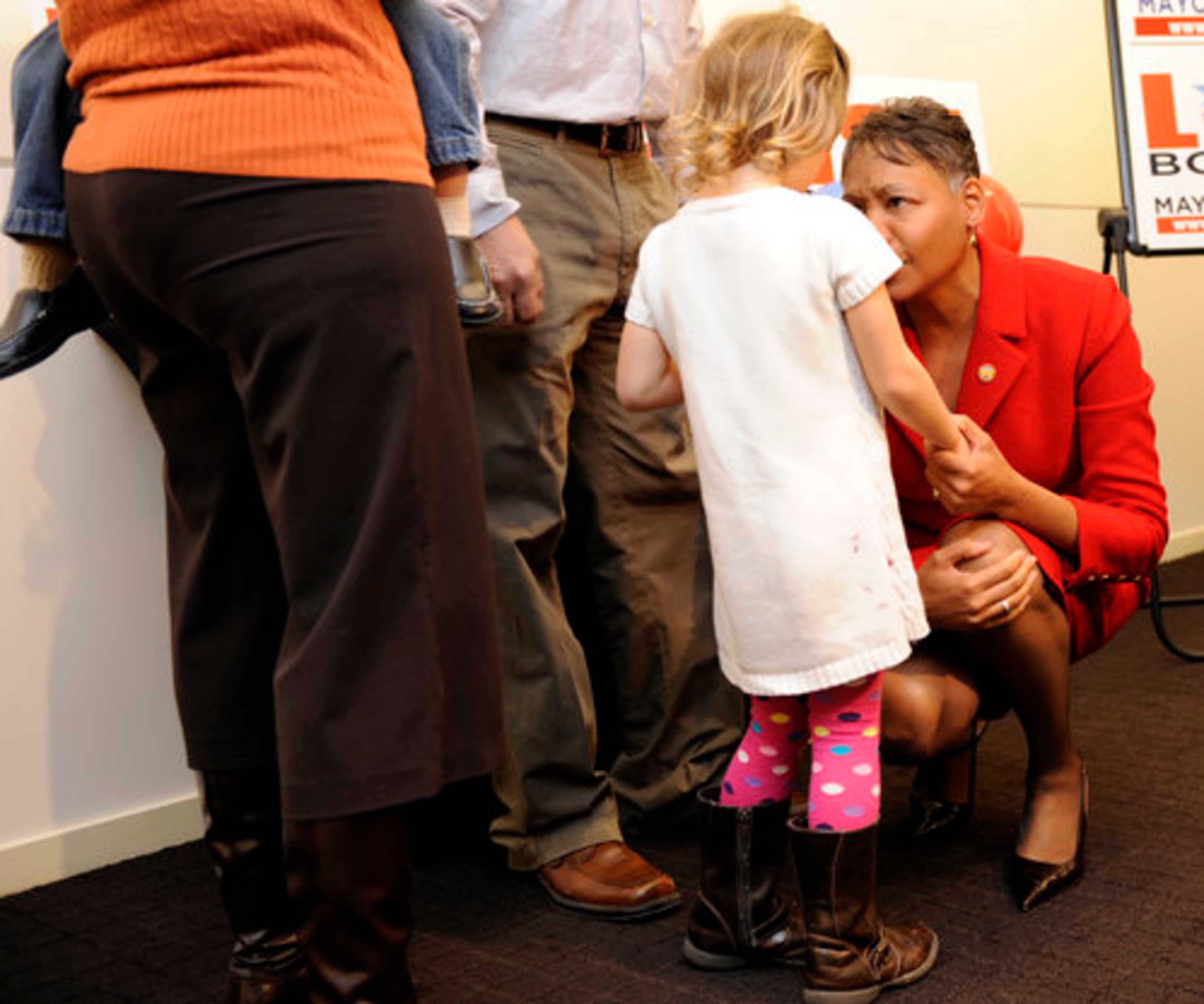 Borders speaks with a young supporter.