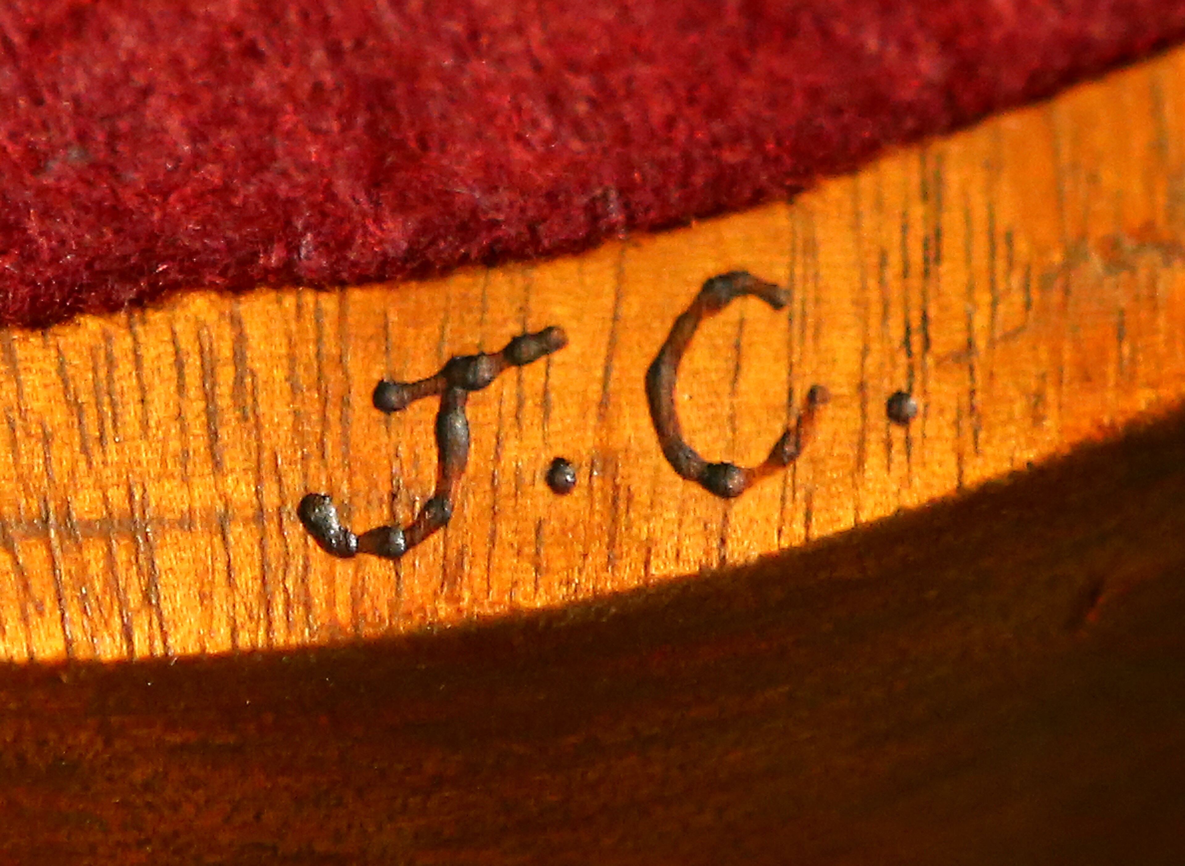 The initials of Jimmy Carter, 39th President of the United States, are seen on the bottom of one of four wooden offering plates he made for Maranatha Baptist Church, where he attends, on Sunday, June 15, 2014, in Plains. CURTIS COMPTON / CCOMPTON@AJC.COM
