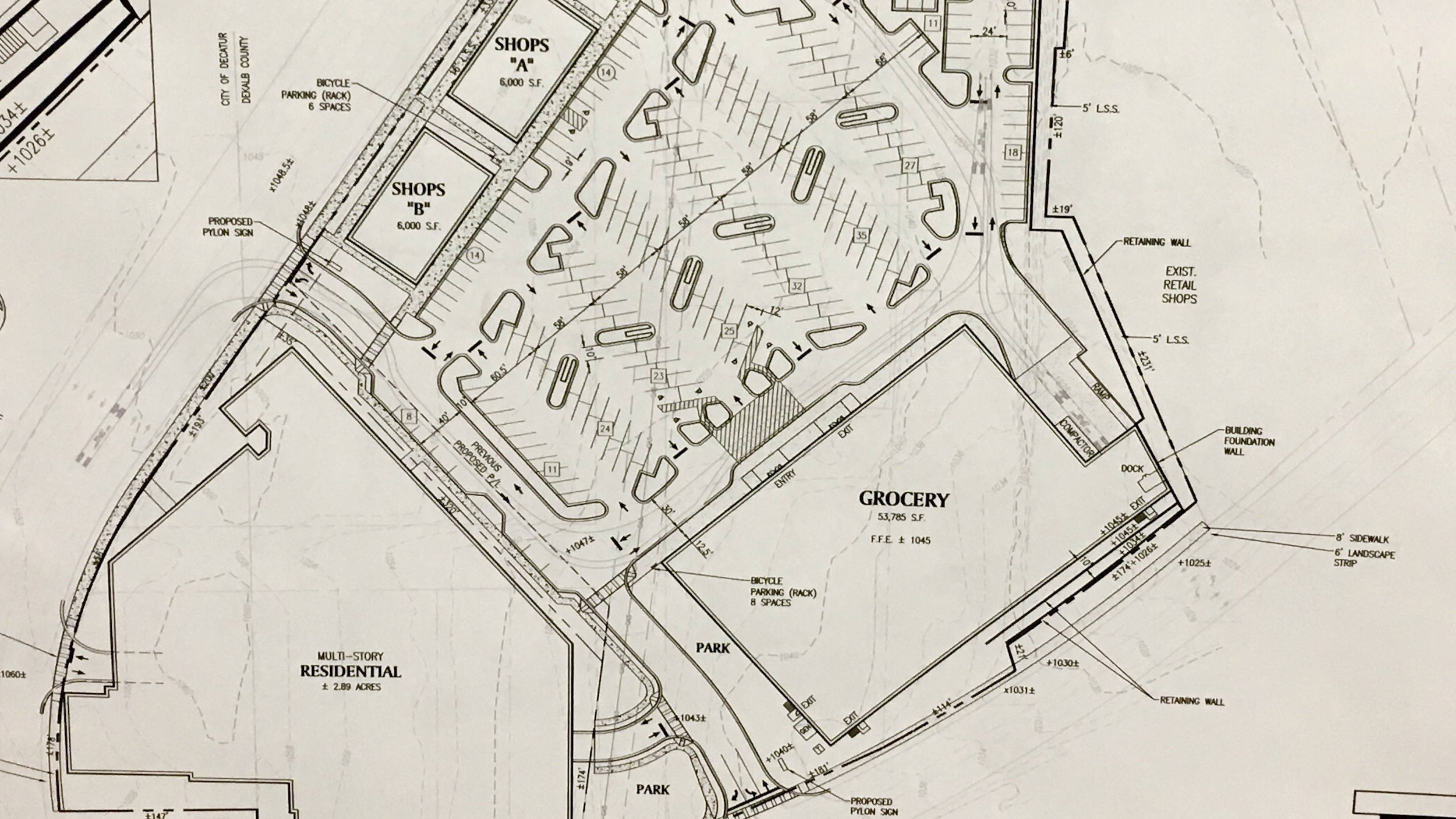 The recent plans for a mixed use development betwen East Ponce de Leon and North Aracadia. 265 apartments will front the project with a grocery (probably a Publix) fronting Ponce and two 6,000 square foot retail structures fronting Arcadia. Courtesdy Alliance Realty Services