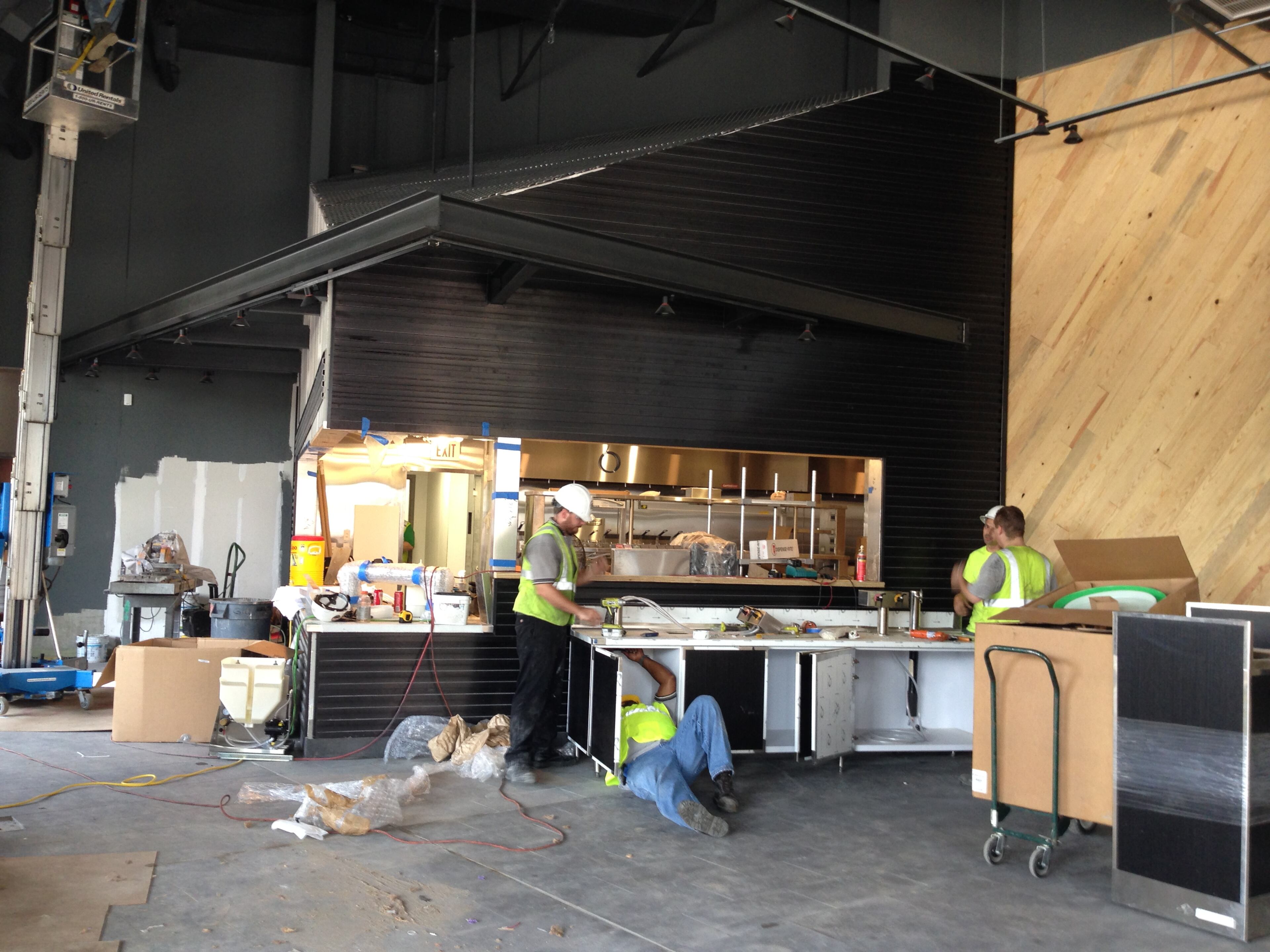 Crews work on the interior of the Shake Shack, one of several restaurants set to make an Atlanta debut at the Buckhead Atlanta project. The billion-dollar retail and restaurant destination that is replacing much of Buckhead's old party district. Buckhead Atlanta is set to open in early September.