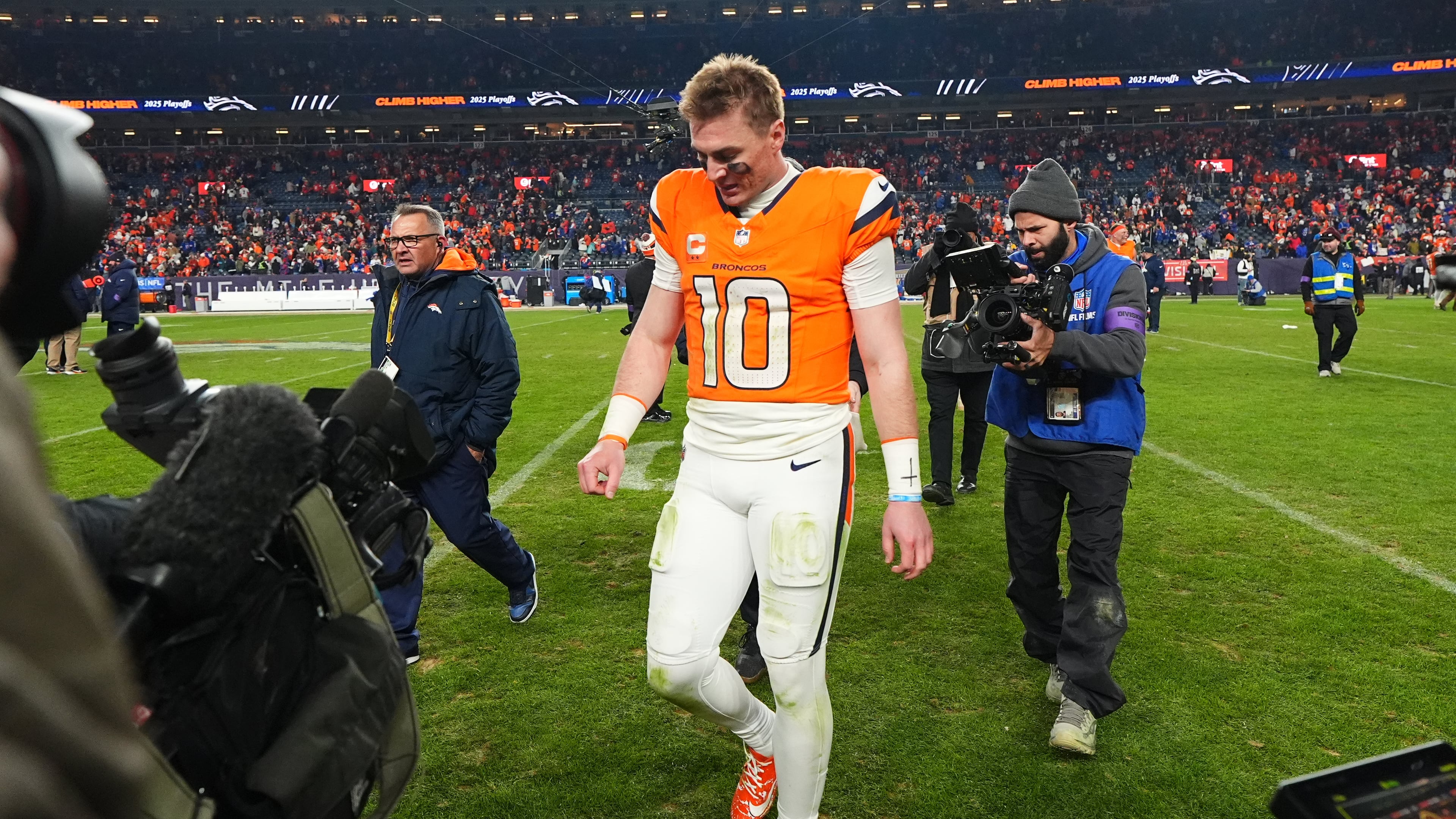 Denver Broncos quarterback Bo Nix leaves the field after an NFL divisional round playoff football game against the Buffalo Bills, Saturday, Jan. 17, 2026, in Denver. (AP Photo/Jack Dempsey)