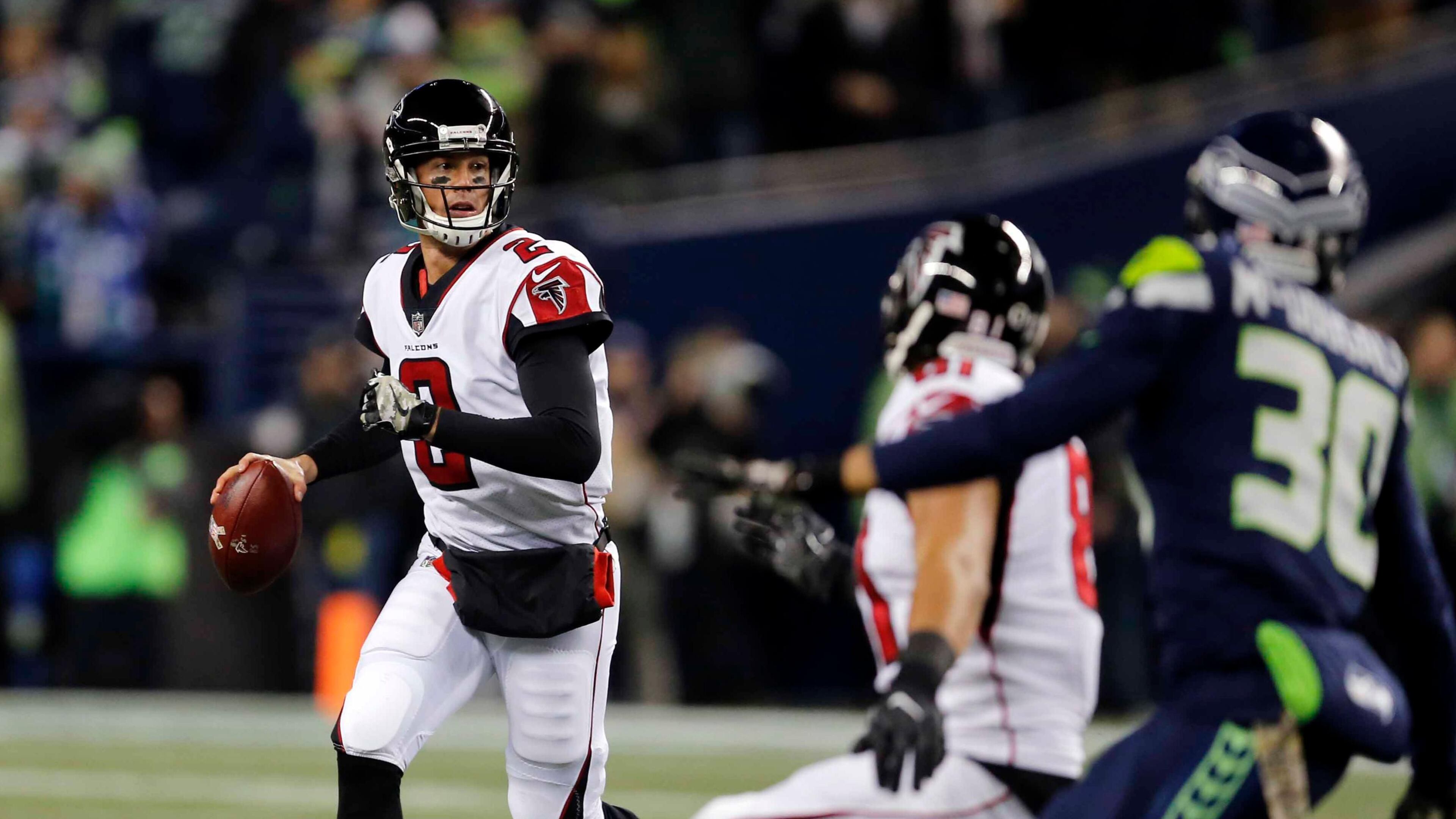 Atlanta Falcons quarterback Matt Ryan (2) looks for room to pass against the Seattle Seahawks in the first half of an NFL football game, Monday, Nov. 20, 2017, in Seattle. (AP Photo/Stephen Brashear)