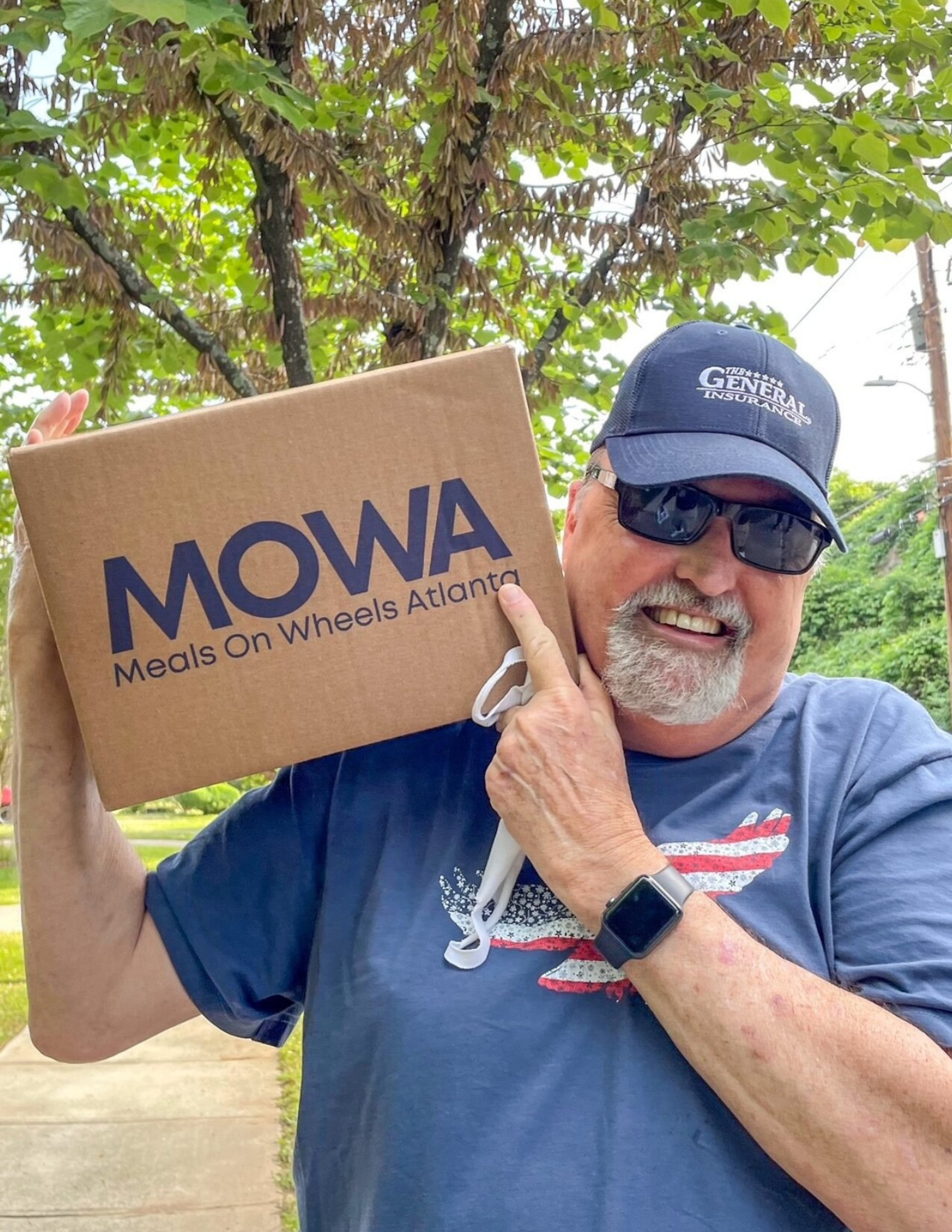Meals On Wheels Atlanta volunteer George Messner prepares to deliver food to recipients. (Courtesy of Meals On Wheels Atlanta)