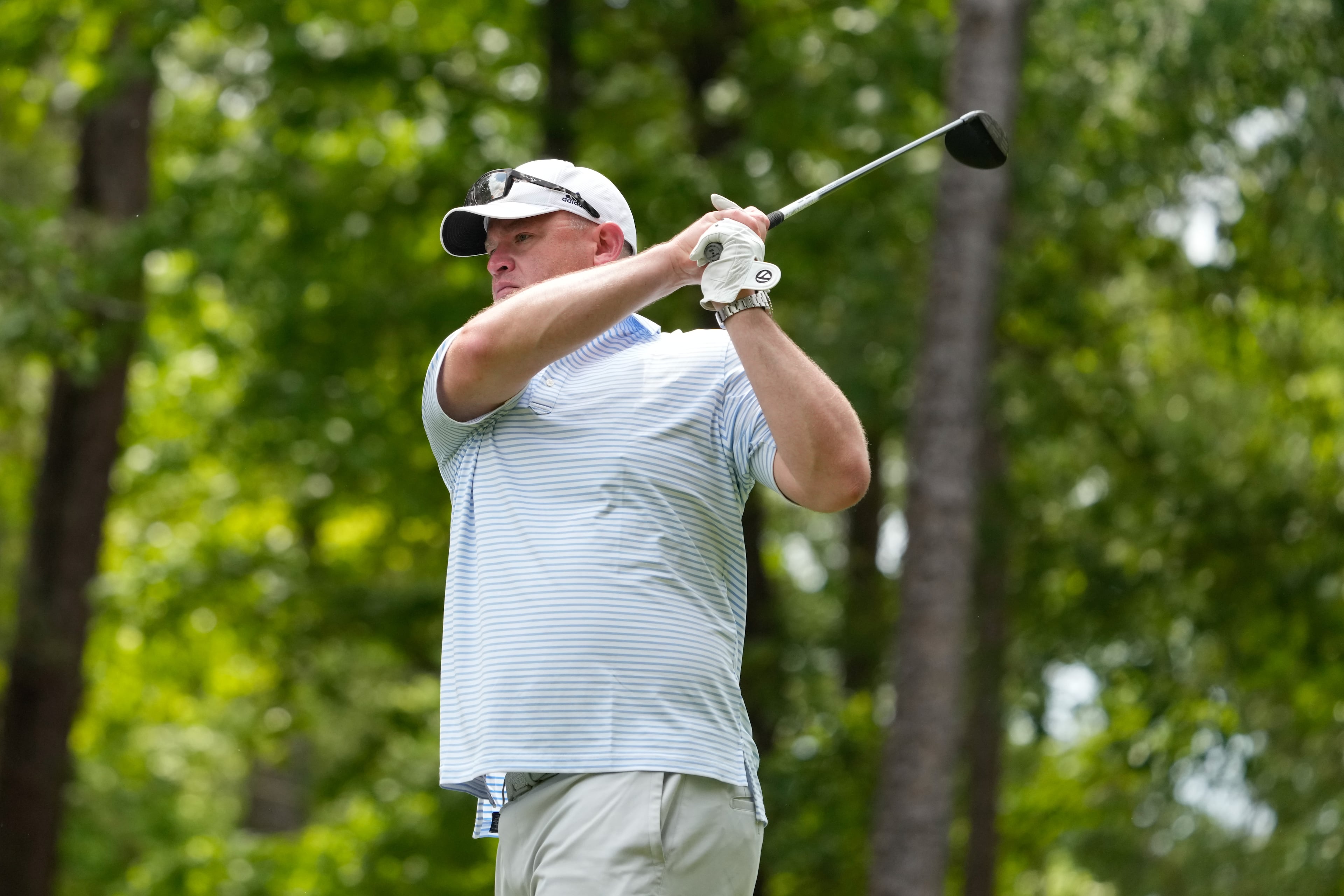 Georgia Tech head football coach Brent Key watches his shot during the 2025 Southern Company Peach Bowl Challenge charity golf tournament