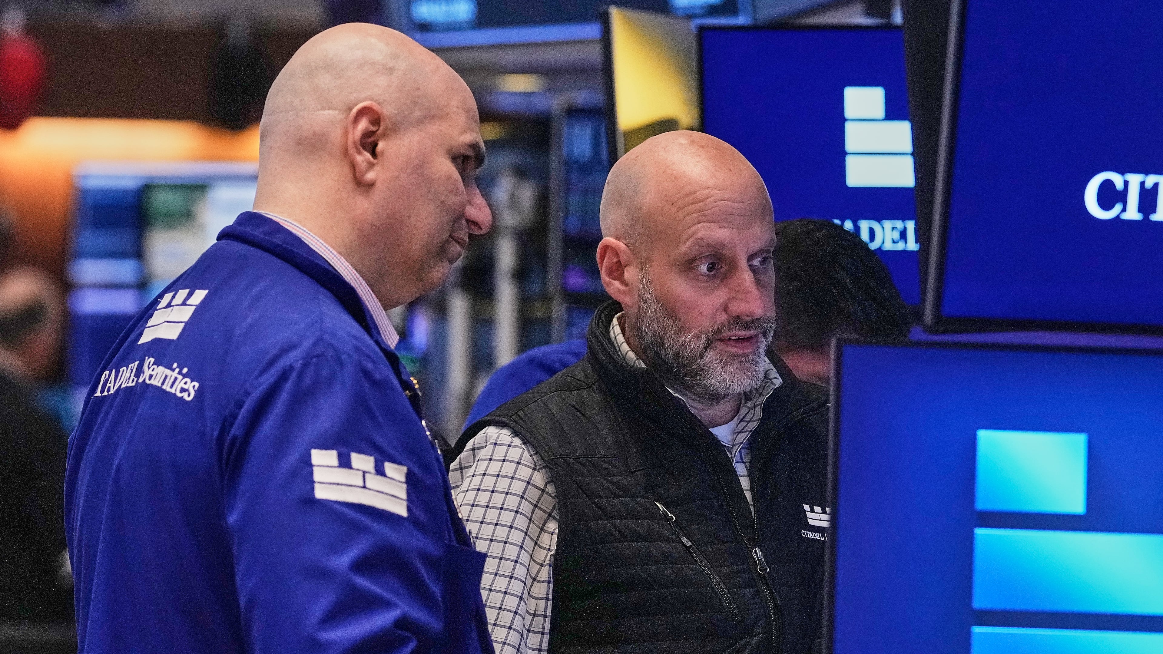 Specialists Philip Finale, left, and Meric Greenbaum work on the floor of the New York Stock Exchange, Friday, May 29, 2026. (AP Photo/Richard Drew)