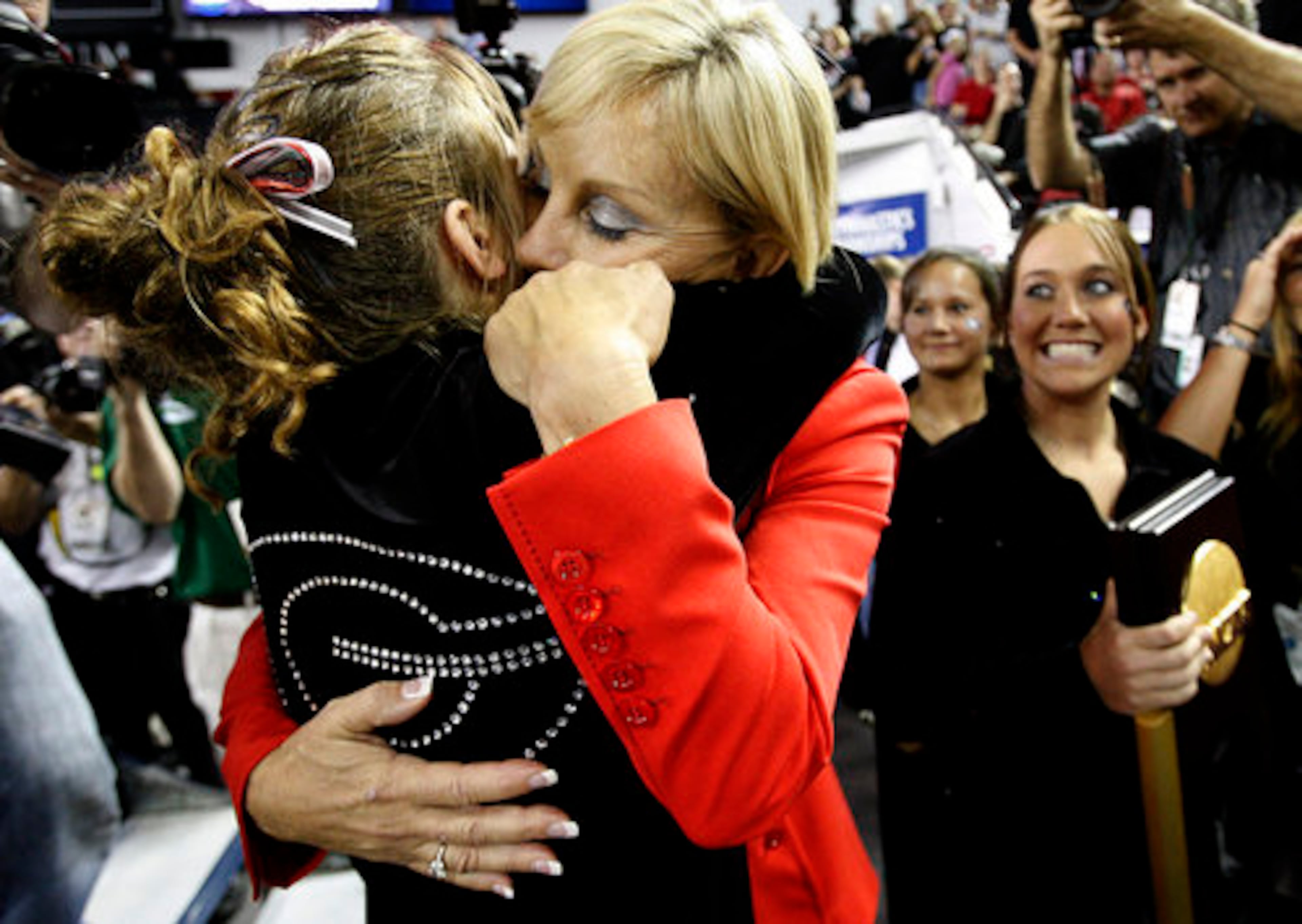 Yoculan is congratulated after achieving her NCAA-best ninth national championship at Georgia -- the last four in a row. She has 16 SEC titles and 20 NCAA Regional crowns. Yoculan's teams have placed in the nation's top three in 19 of the last 20 years.