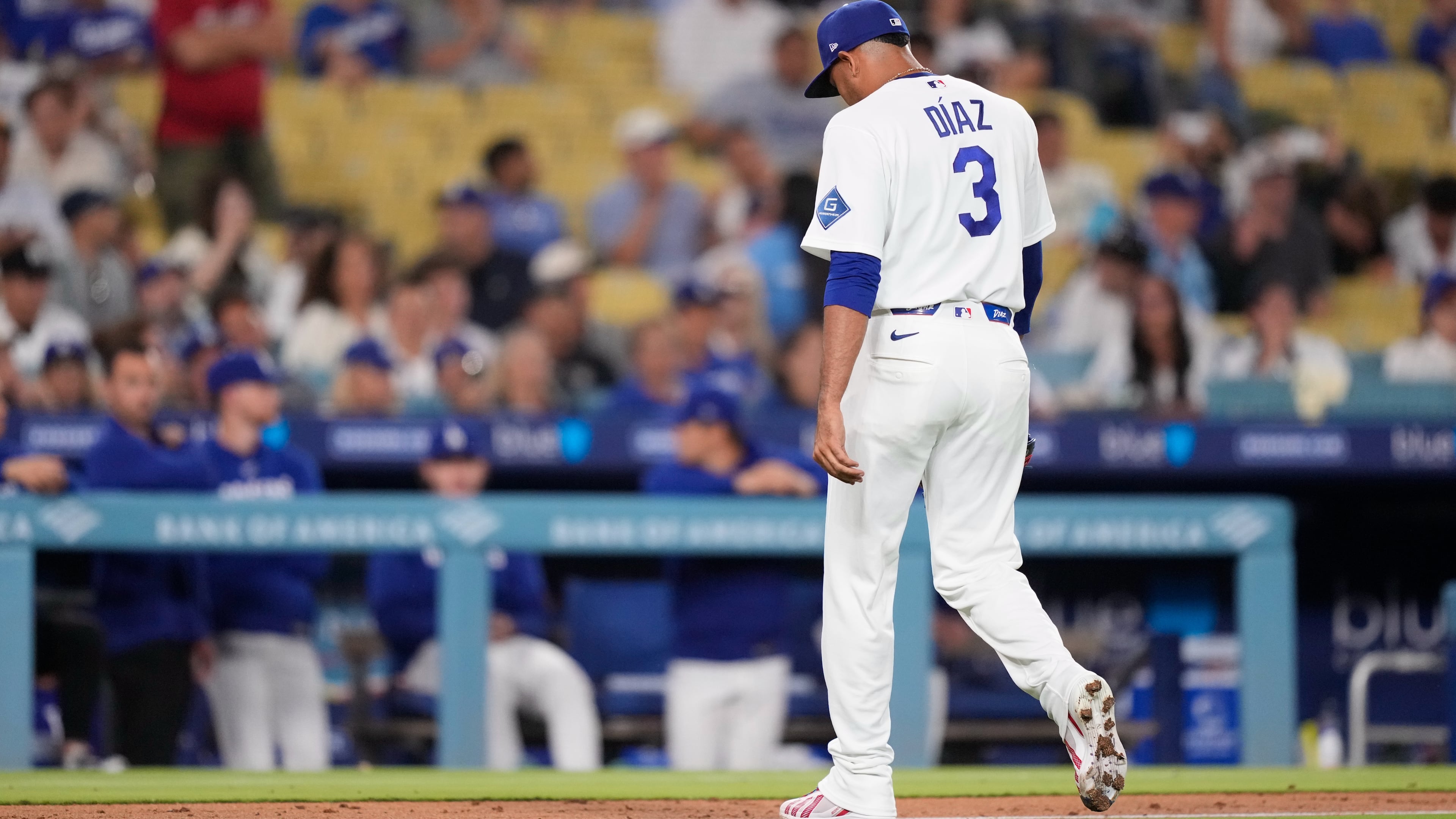 Los Angeles Dodgers pitcher Edwin Díaz walks off the field after being taken out of the game during the ninth inning of a baseball game against the Milwaukee Brewers, Thursday, Aug. 13, 2026, in Los Angeles. (AP Photo/Mark J. Terrill)