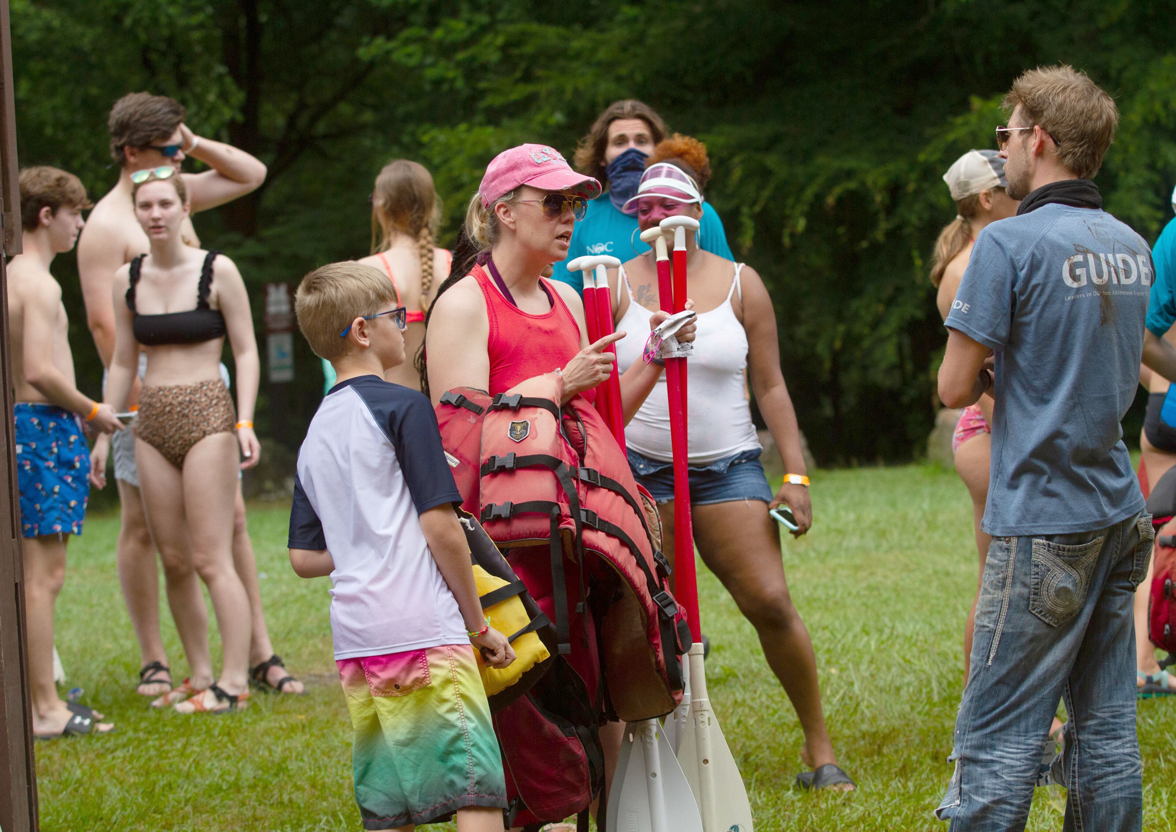 Nantahala Outdoor Center employees get rafts and inner tubes ready for customers at the Powers Island Park in Sandy Springs on Sunday, June 28, 2020. STEVE SCHAEFER FOR THE ATLANTA JOURNAL-CONSTITUTION