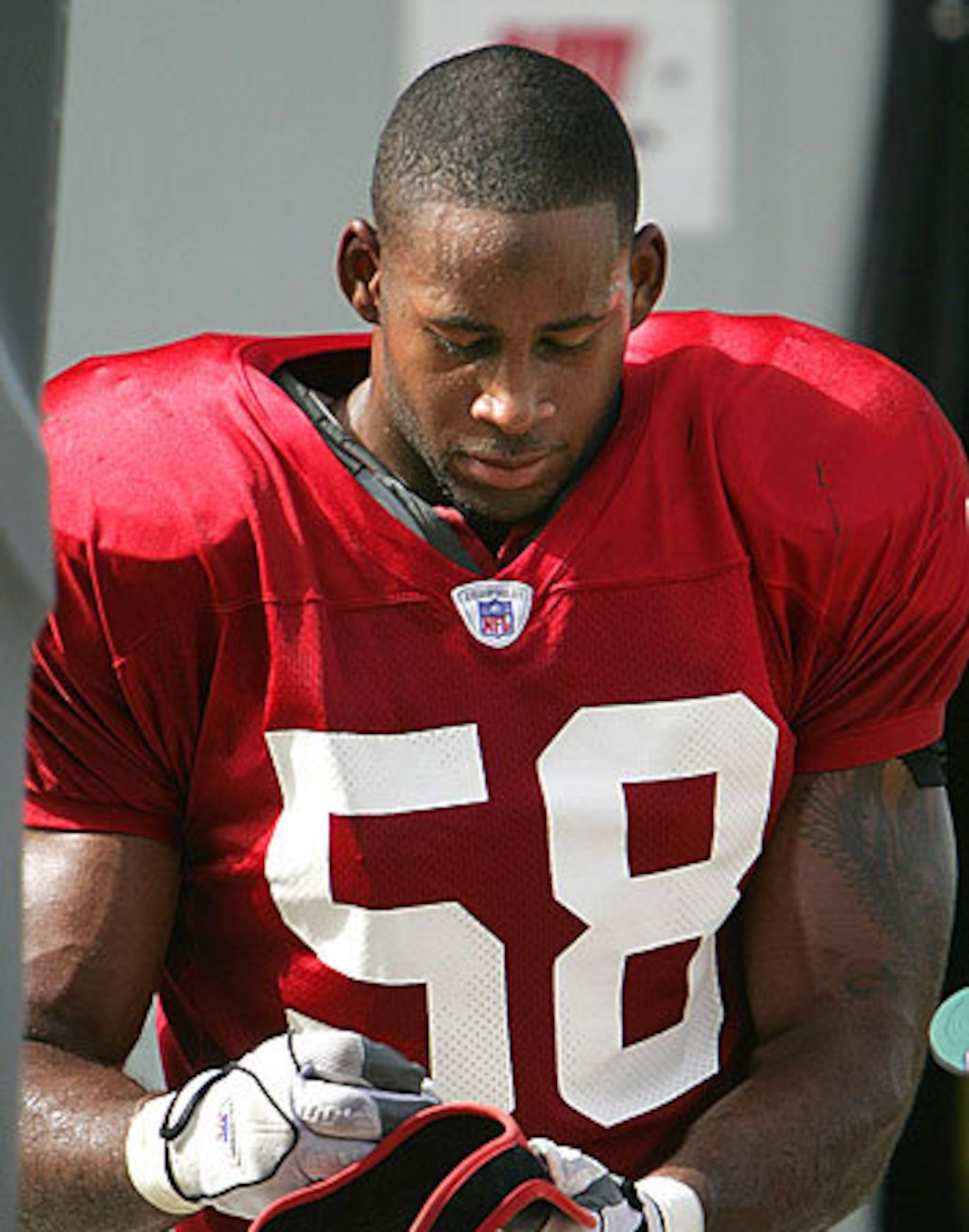 Tampa Bay Buccaneers linebacker Marquis Cooper (58) signs autographs between practice sessions during 2006 football training camp in Lake Buena Vista, Fla. The capsized boat found March 2 belongs to Cooper.