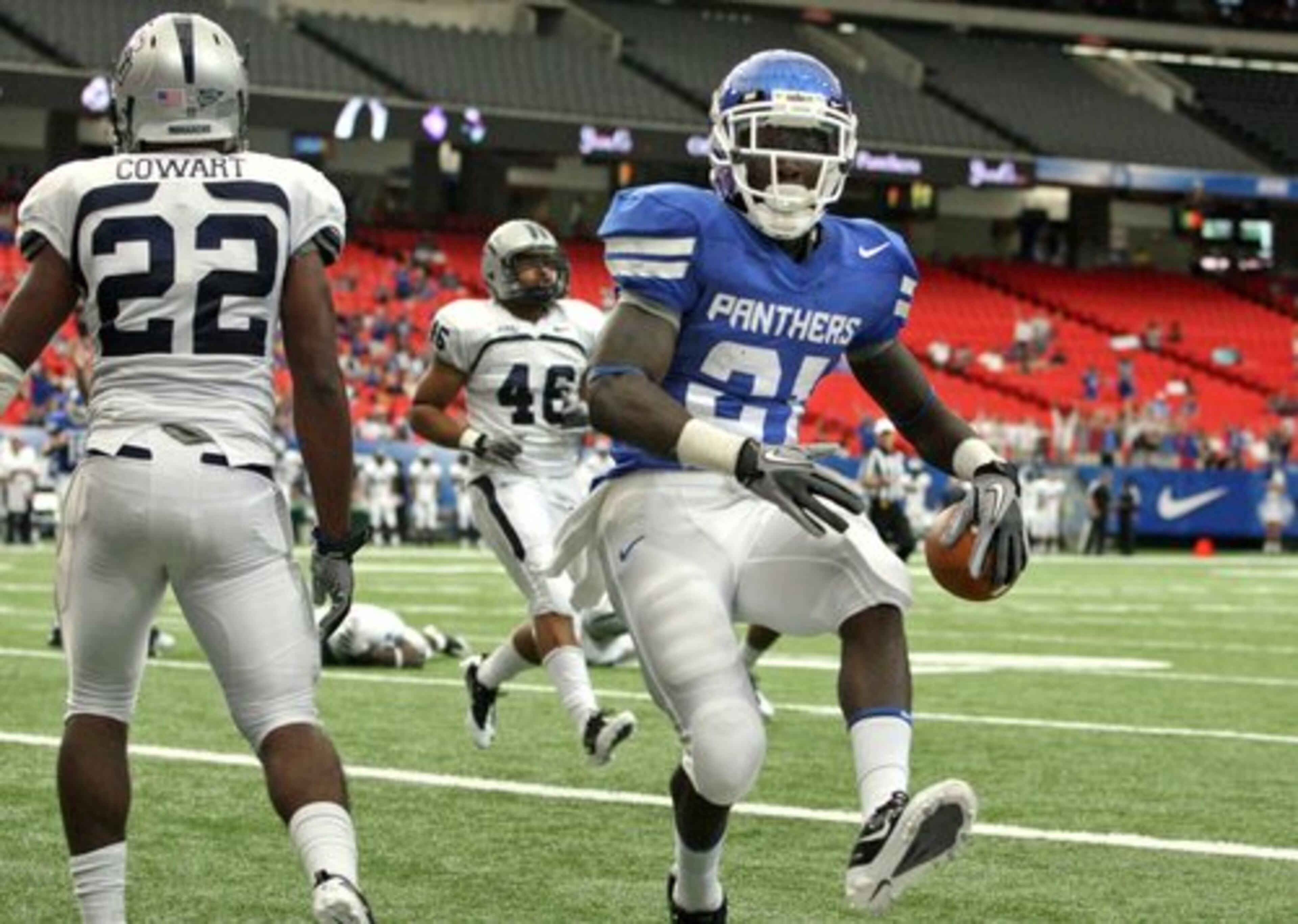 Panthers running back Travis Evans scores on a 5-yard run in the first half.
