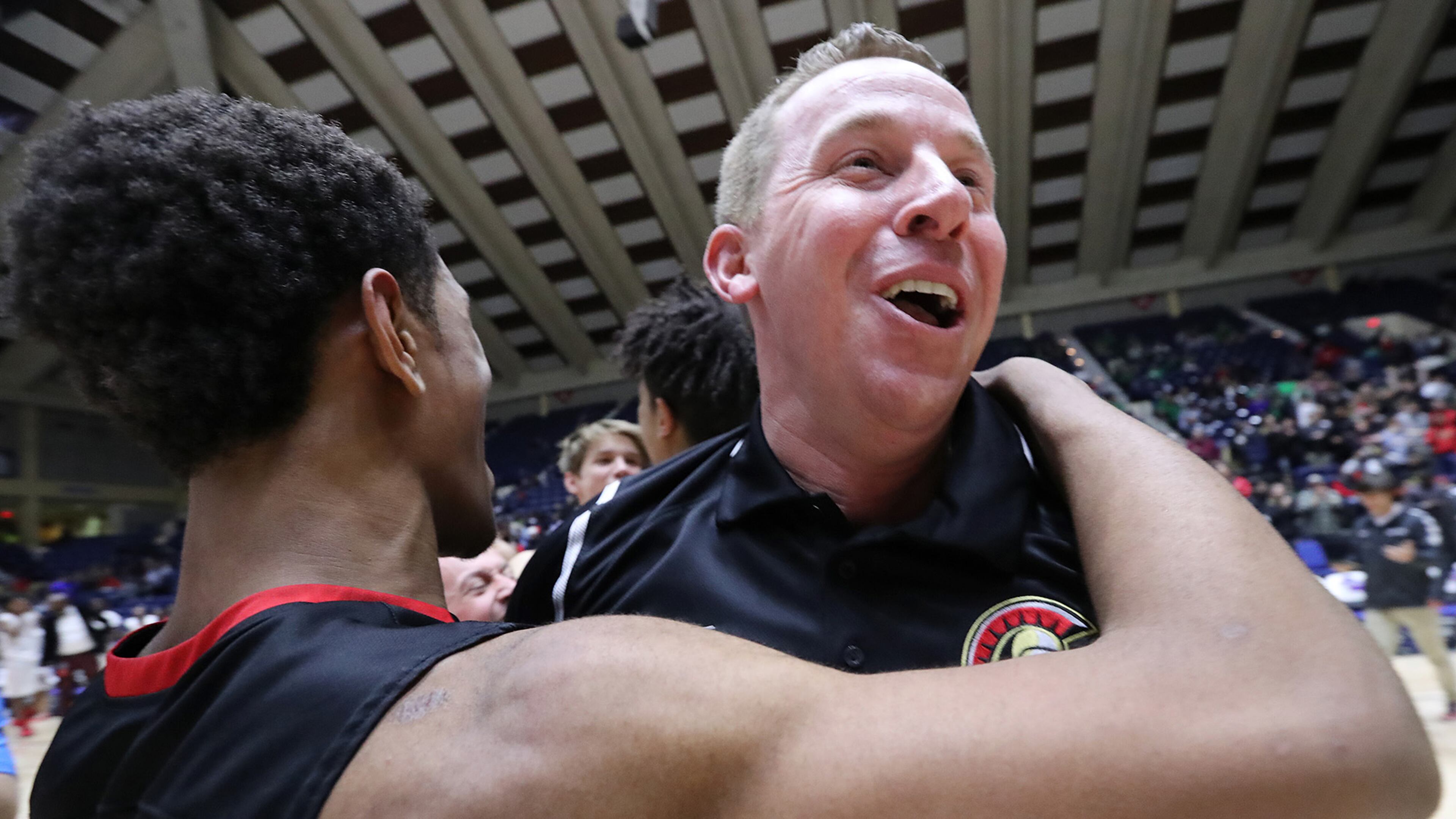 GAC head coach David Eaton celebrates beating Jenkins, 67-53, to win the Class AAA state basketball championship game on Thursday, March 8, 2018, in Macon, Ga.