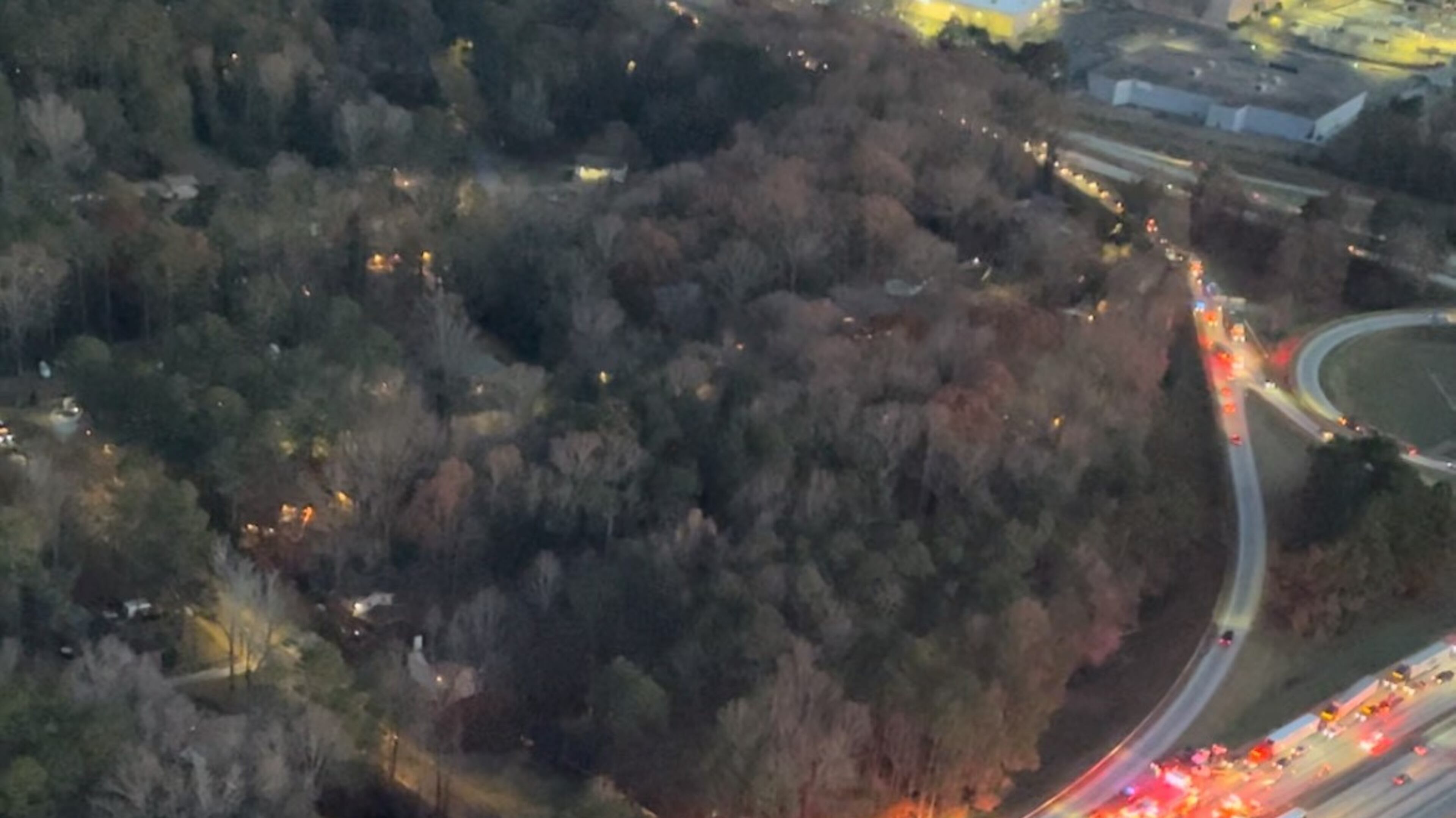 A huge chemical spill response from Atlanta Fire and GDOT shuts down I-285/northbound at Highway 166 in Southwest Atlanta on December 7, 2023. Credit: Doug Turnbull, WSB Skycopter