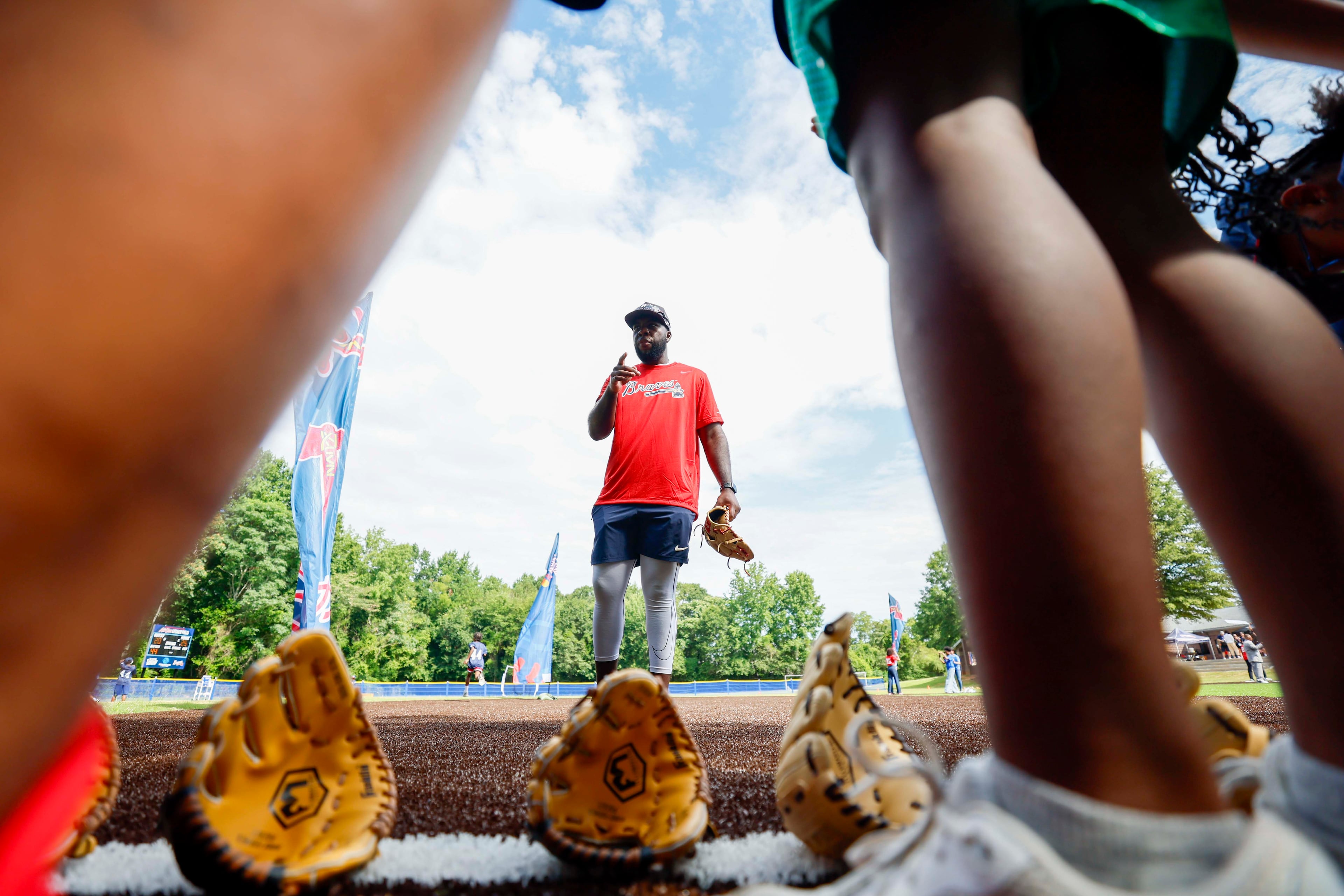 A coach is observed giving instructions to the kids during the unveiling of the new All-Star Legacy Field at the Barksdale Boys & Girls Club in Conyers on Thursday, July 10, 2025. The event takes place during the MLB All-Star Game week in Atlanta.
(Miguel Martinez/ AJC)