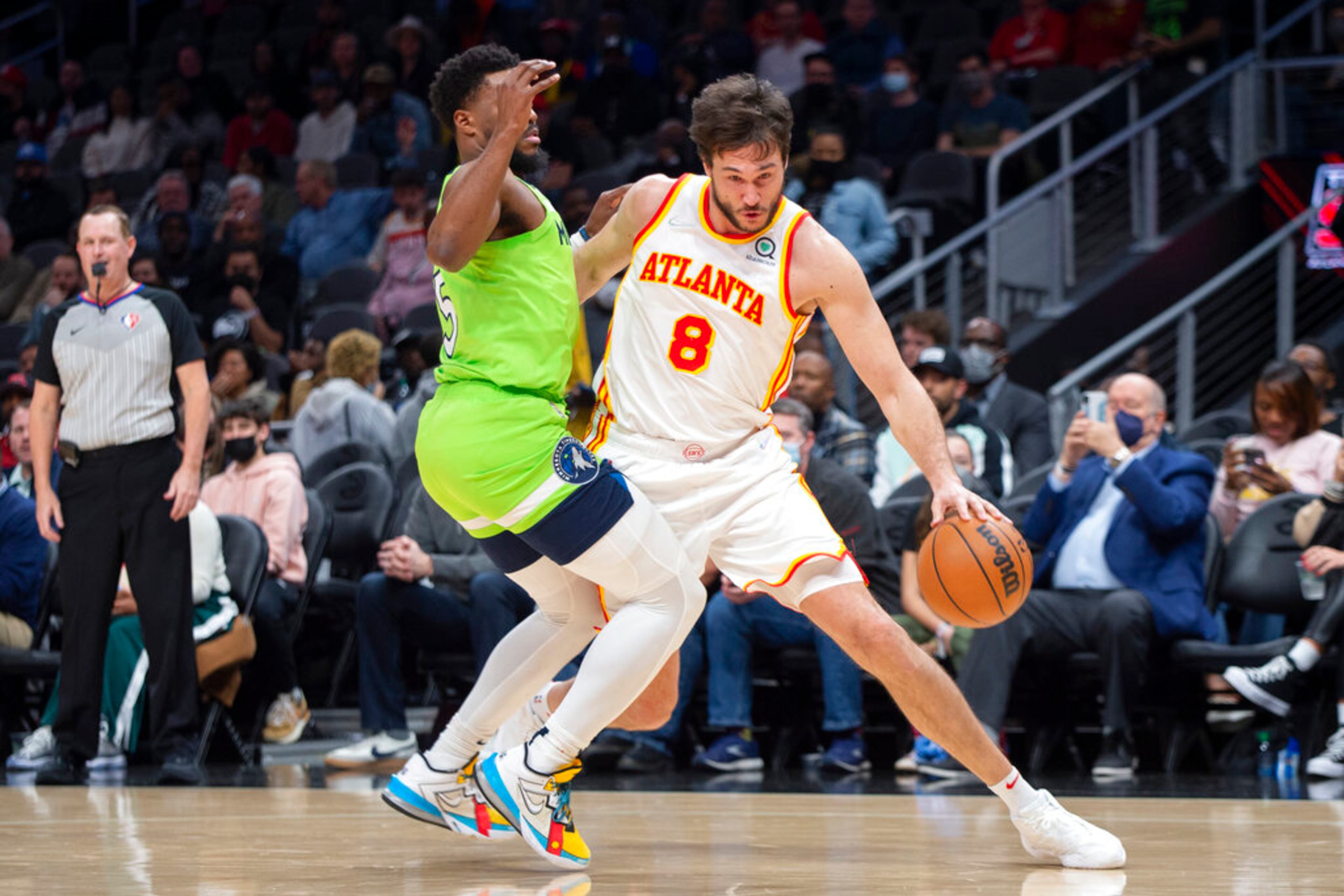 Atlanta Hawks forward Danilo Gallinari (8) works against Minnesota Timberwolves guard Malik Beasley (5) during the first half of an NBA basketball game Wednesday, Jan. 19, 2022, in Atlanta. (AP Photo/Hakim Wright Sr.)