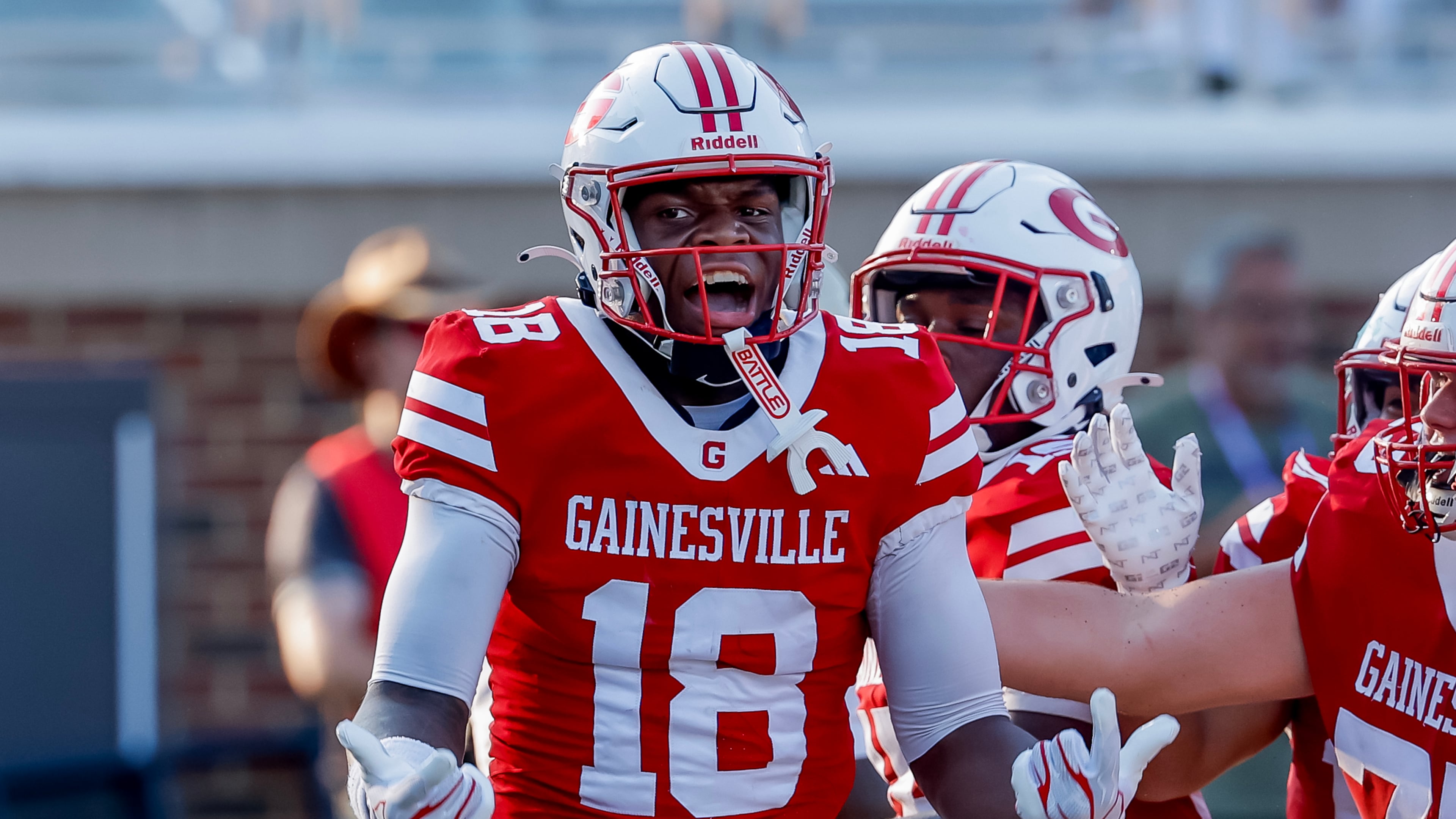 Gainesville's Collin Porterfield celebrates his touchdown against Buford during the second half of a high school football game between Buford and Gainesville, Saturday, Aug. 22, 2026, in Buford, GA. (Erik S. Lesser for the AJC)