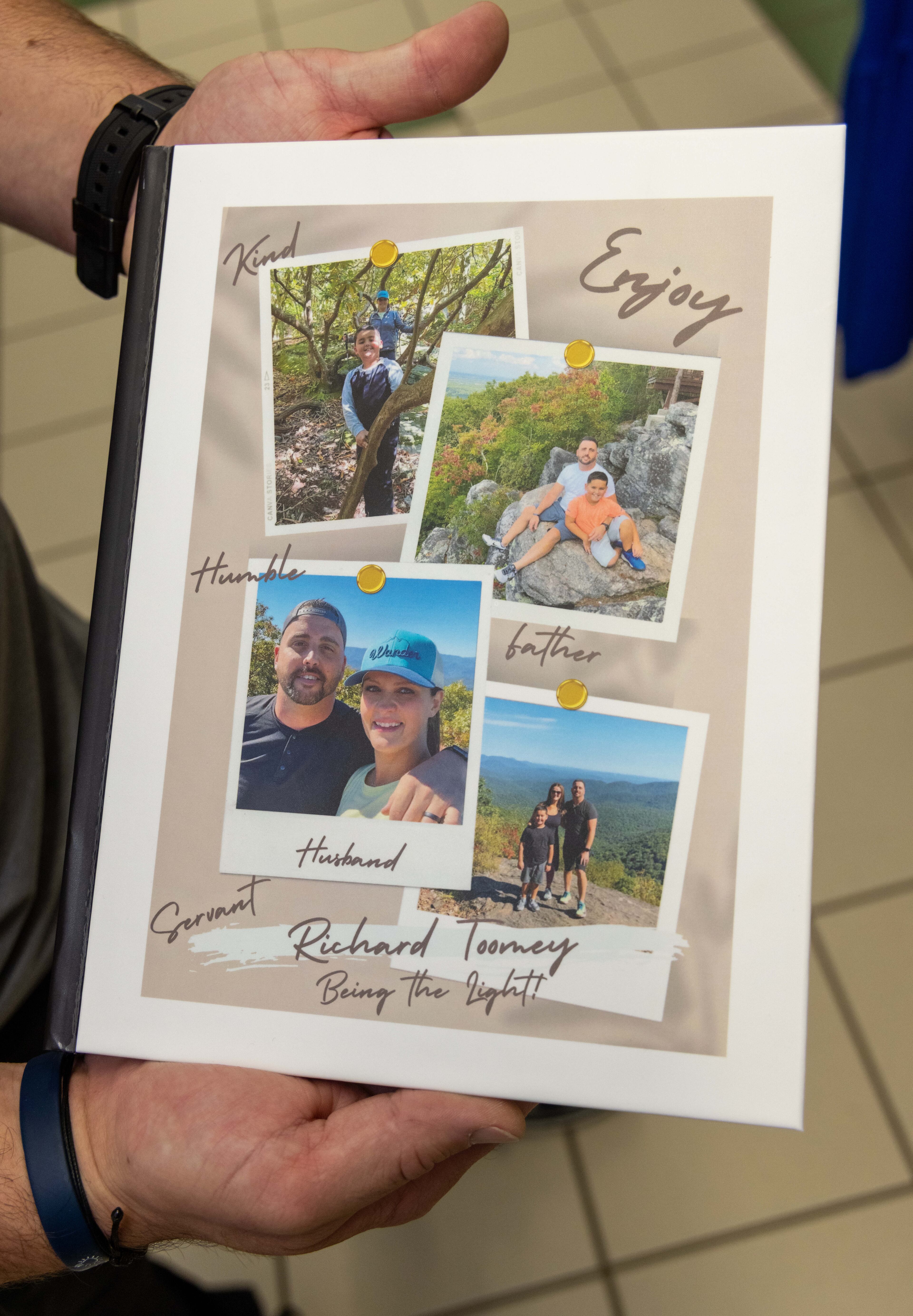 Richard Toomey holds a book of student and staff recommendations. PHIL SKINNER FOR THE ATLANTA JOURNAL-CONSTITUTION