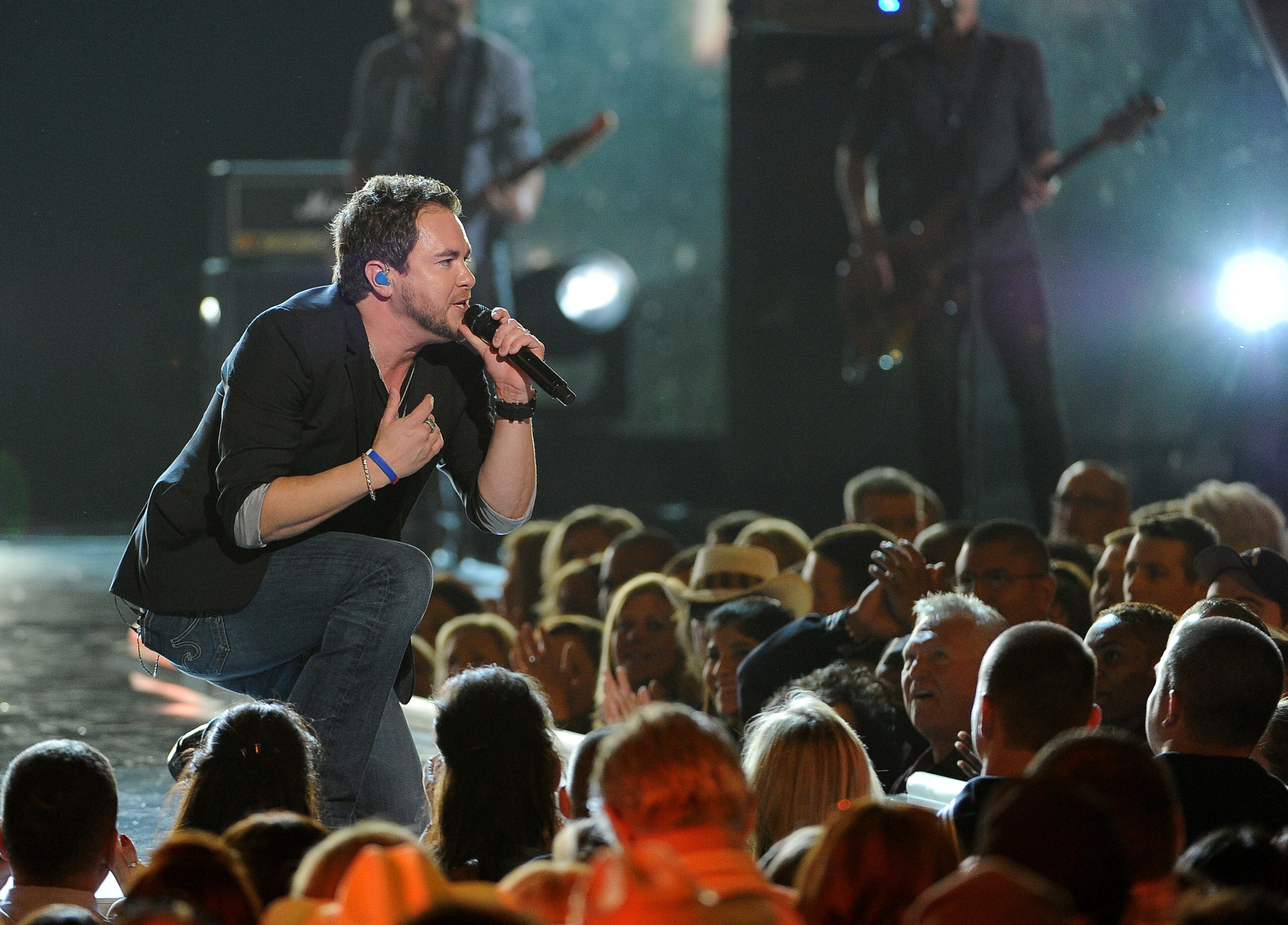 Mike Eli, of the Eli Young Band, performs at ACM Presents an All-Star Salute to the Troops on Monday, April 7, 2014, in Las Vegas. (Photo by Chris Pizzello/Invision/AP)