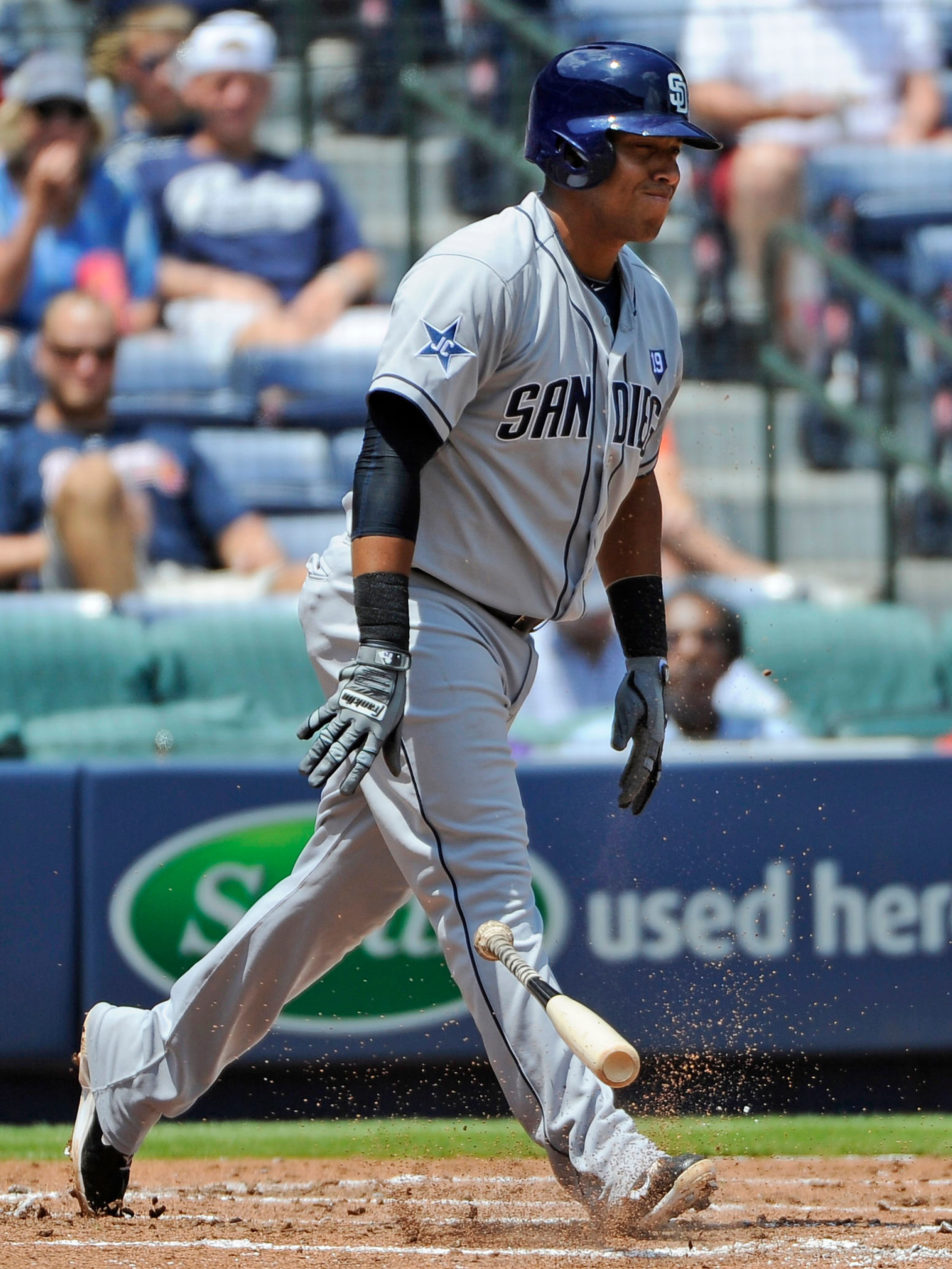San Diego Padres' Yangervis Solarte throws his bat to the ground after a swinging strike three against the Atlanta Braves during the third inning of a baseball game Monday, July 28, 2014, in Atlanta.