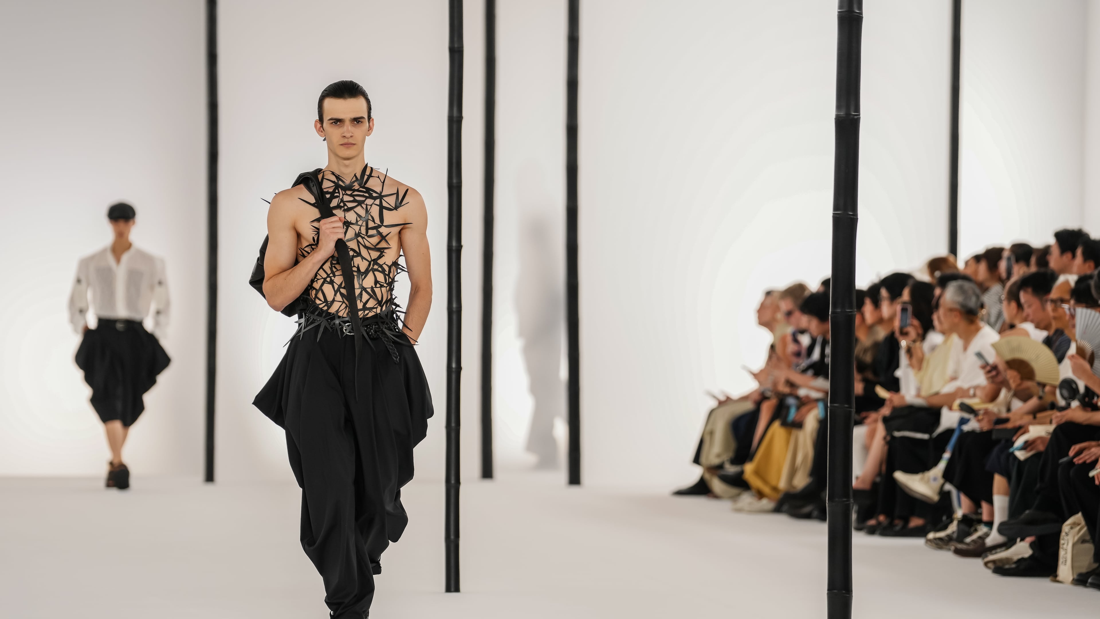 A model wears a creation as part of the Issey Miyake Homme Spring Summer 2027 collection presented in Paris, France, Thursday, June 25, 2026. (AP Photo/Aurelien Morissard)