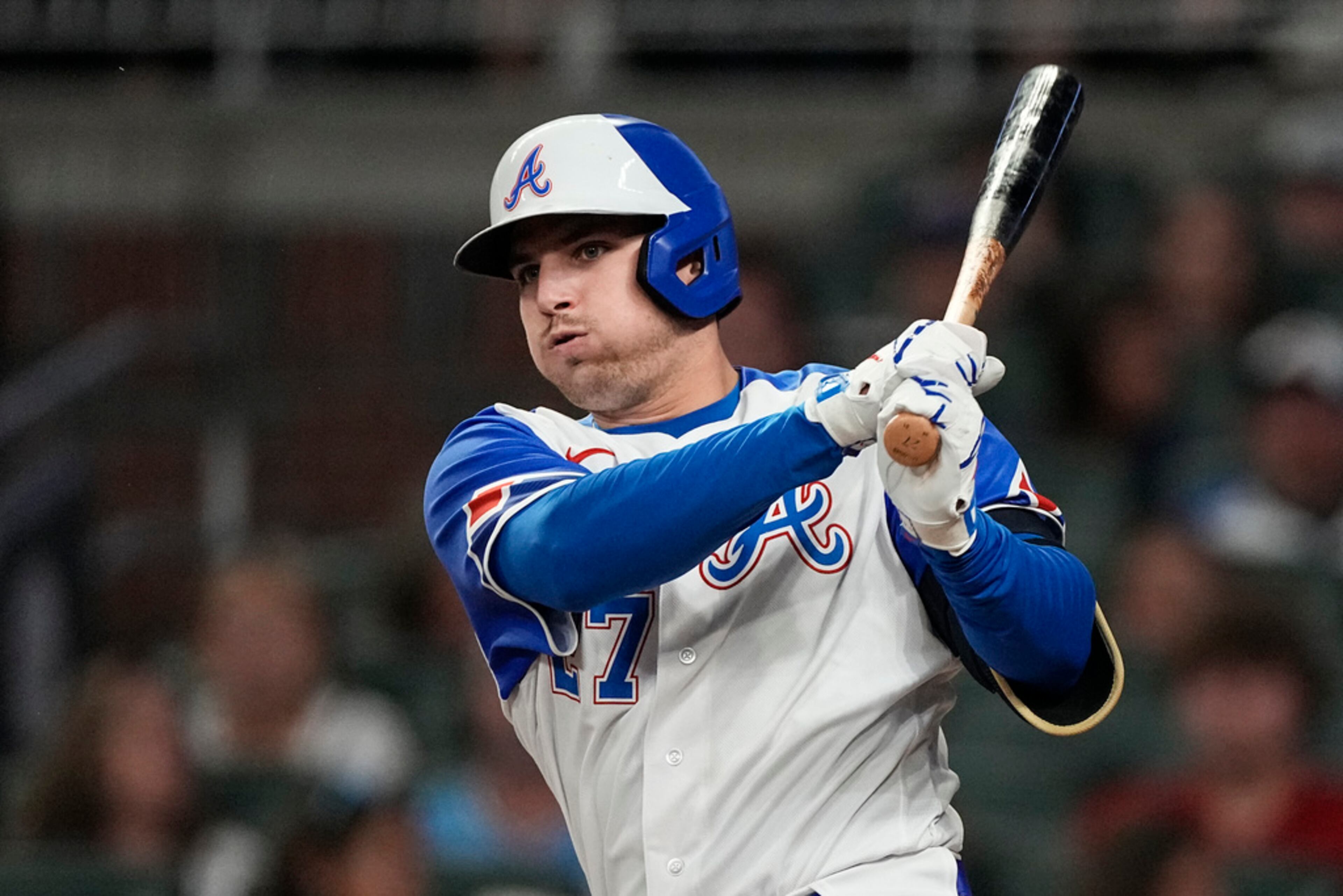 Atlanta Braves third baseman Austin Riley (27) hits a double in the eighth inning of a baseball game against the Baltimore Orioles Saturday, May 6, 2023, in Atlanta. (AP Photo/John Bazemore)