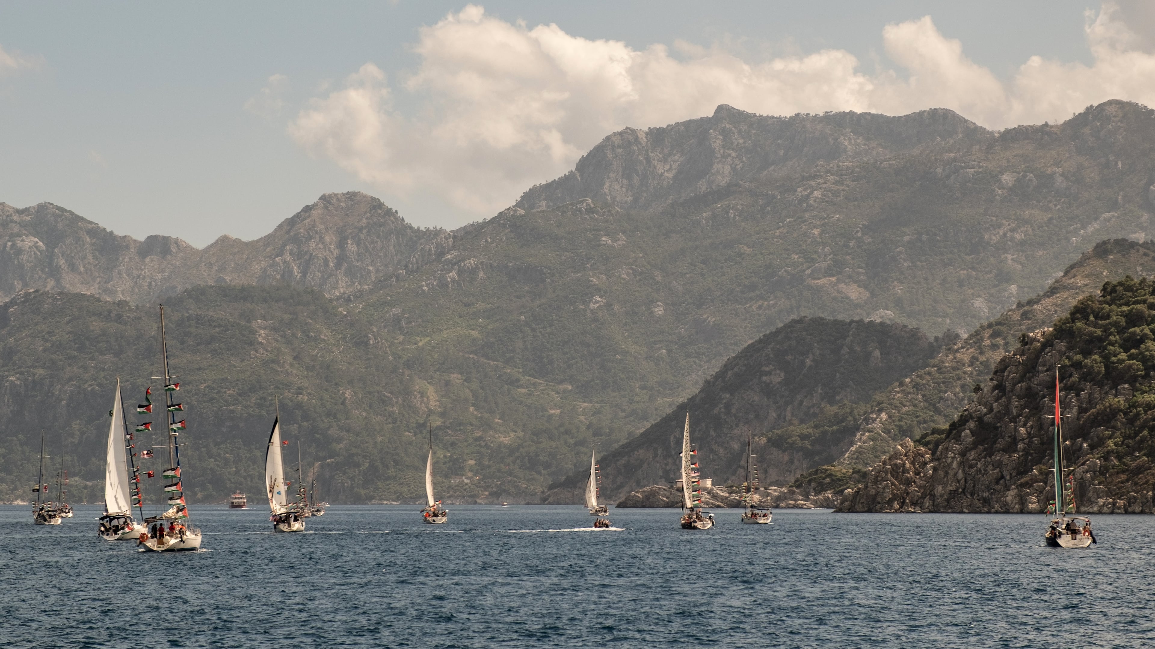 Boats belonging to the Global Sumud Flotilla, carrying activists and humanitarian aid, depart for Gaza from the port of Marmaris, Turkey, Thursday, May 14, 2026, in an attempt to break the Israeli naval blockade. (AP Photo/Murat Kocabas)