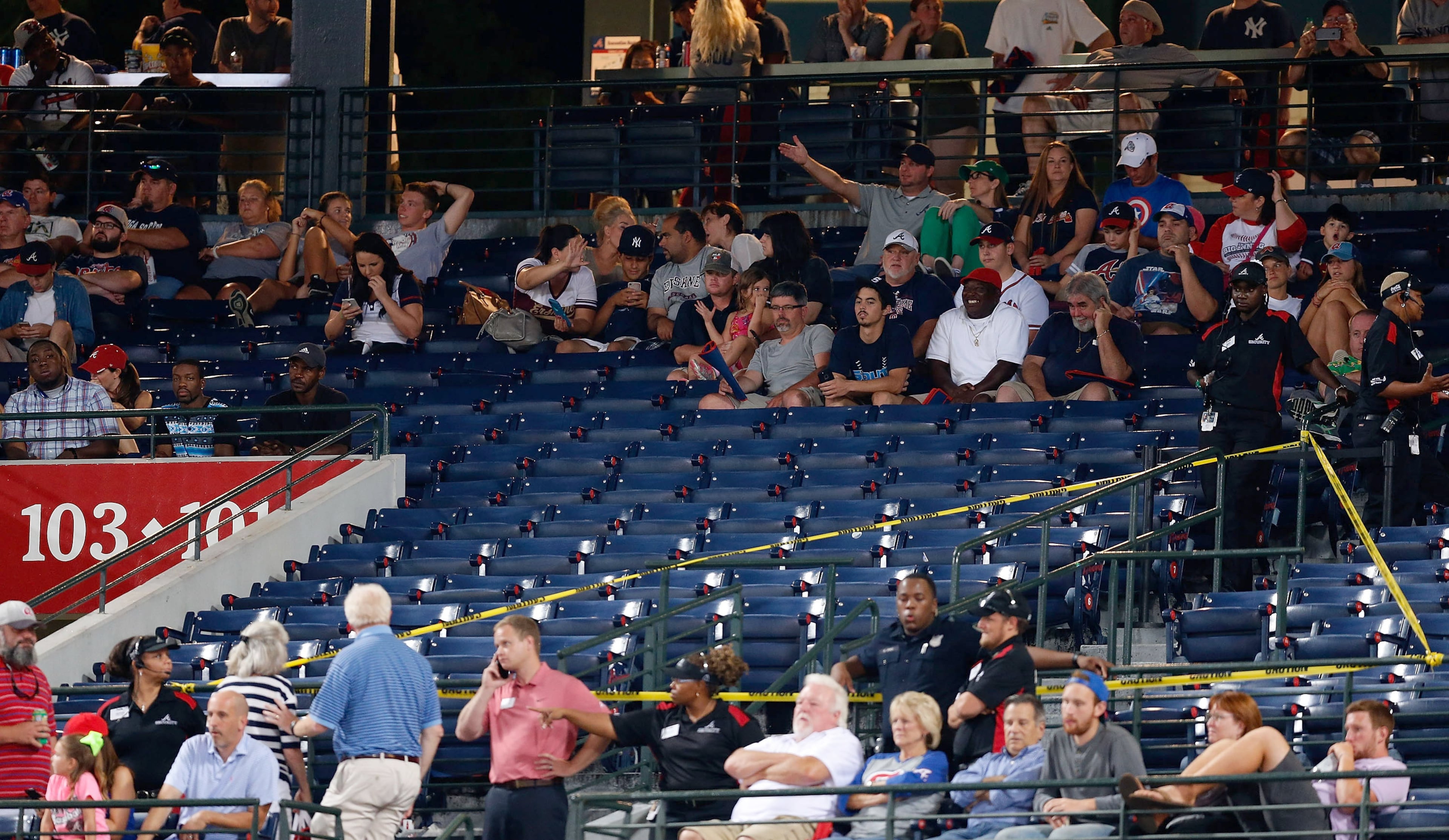 Police block off a section with police tape after a fan fell from the upper deck of Turner Field in the seventh inning during the game between the Atlanta Braves and the New York Yankees on August 29, 2015 in Atlanta, Georgia. (Photo by Mike Zarrilli/Getty Images)