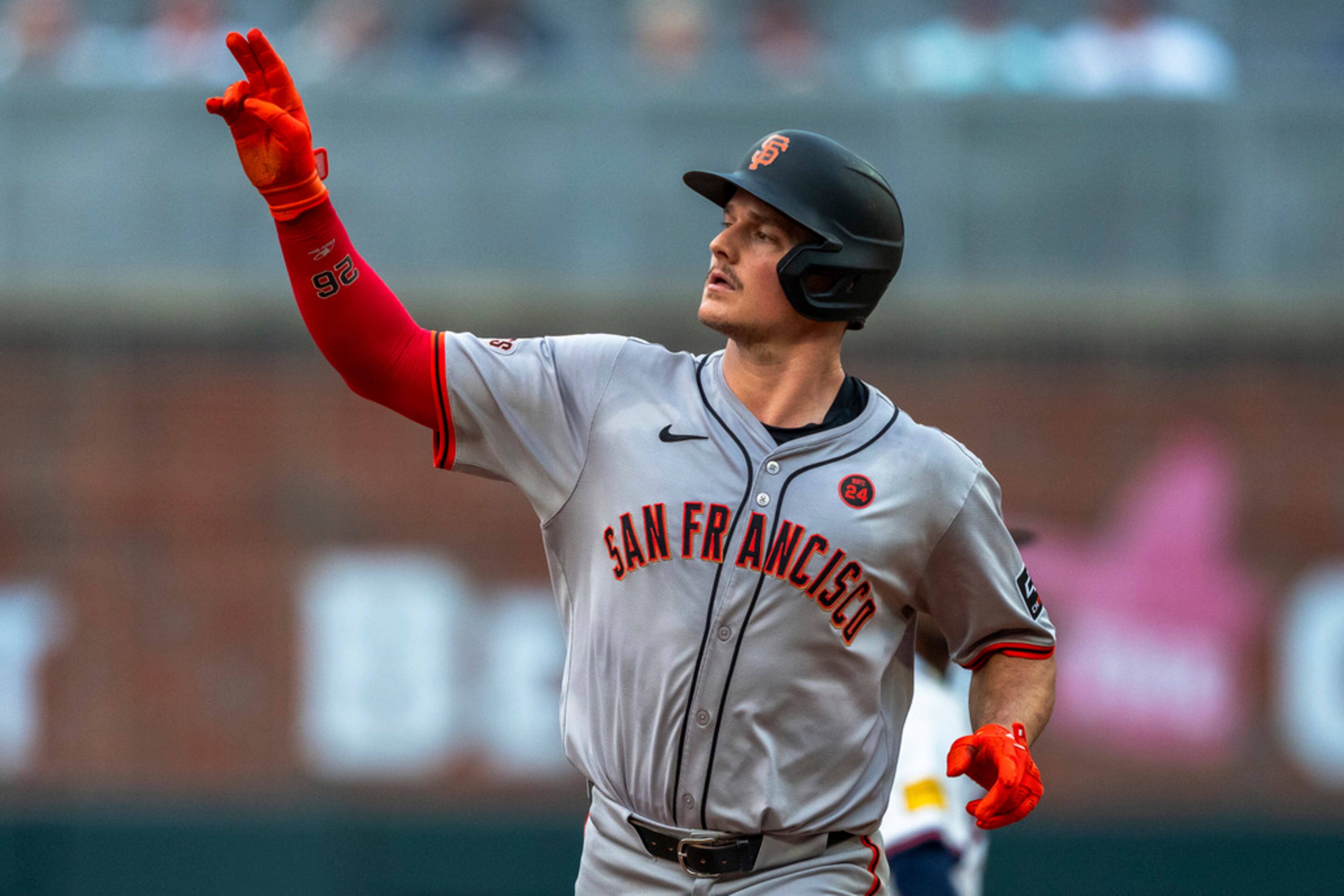 San Francisco Giants Matt Chapman rounds second base after hitting a home run to center field during the fourth inning of a baseball game against the Atlanta Braves, Thursday, July 4, 2024, in Atlanta. (AP Photo/Jason Allen)