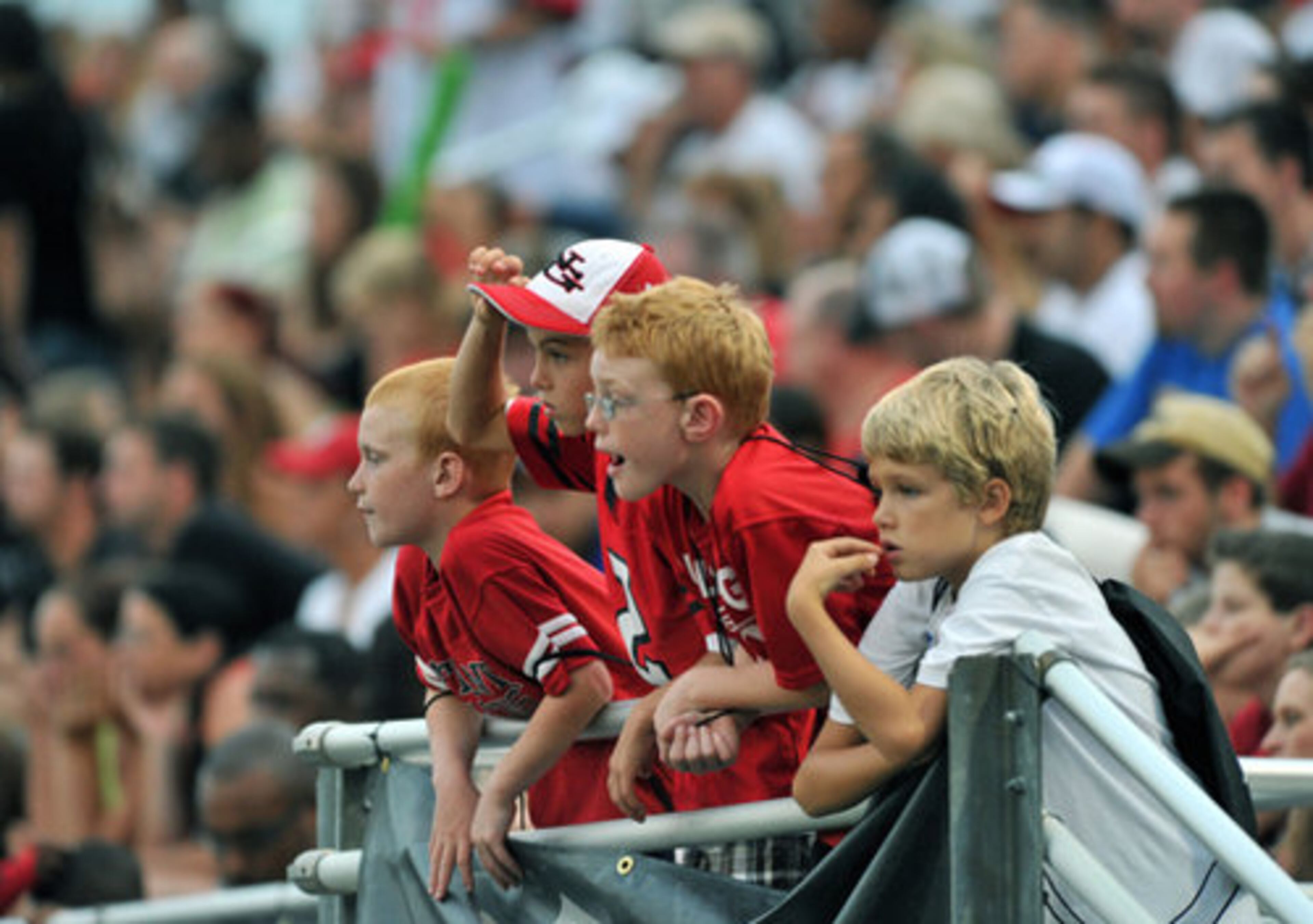Young fans watch Atlanta Falcons playing during the Friday Night Lights at North Gwinnett High School in Suwanee.