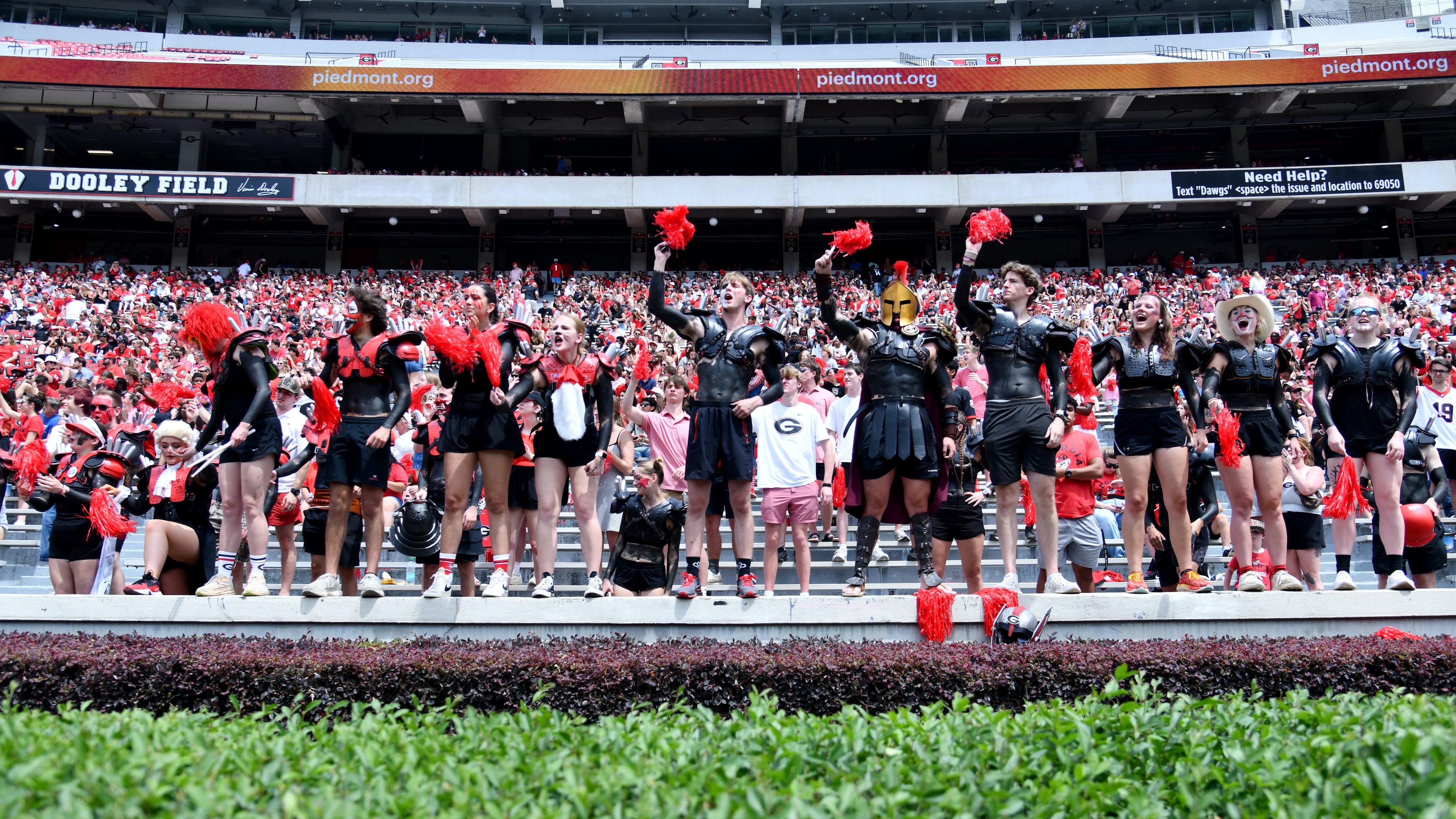 Georgia fans cheer during G-Day at Sanford Stadium on Saturday, April 18, 2026, in Athens. Fans who won't be able to make it to Sanford Stadium next season will have new voices to listen to calling the games on the Georgia Bulldogs Sports Network — Jeff Dantzler and Jon Stinchcomb. (Hyosub Shin/AJC)