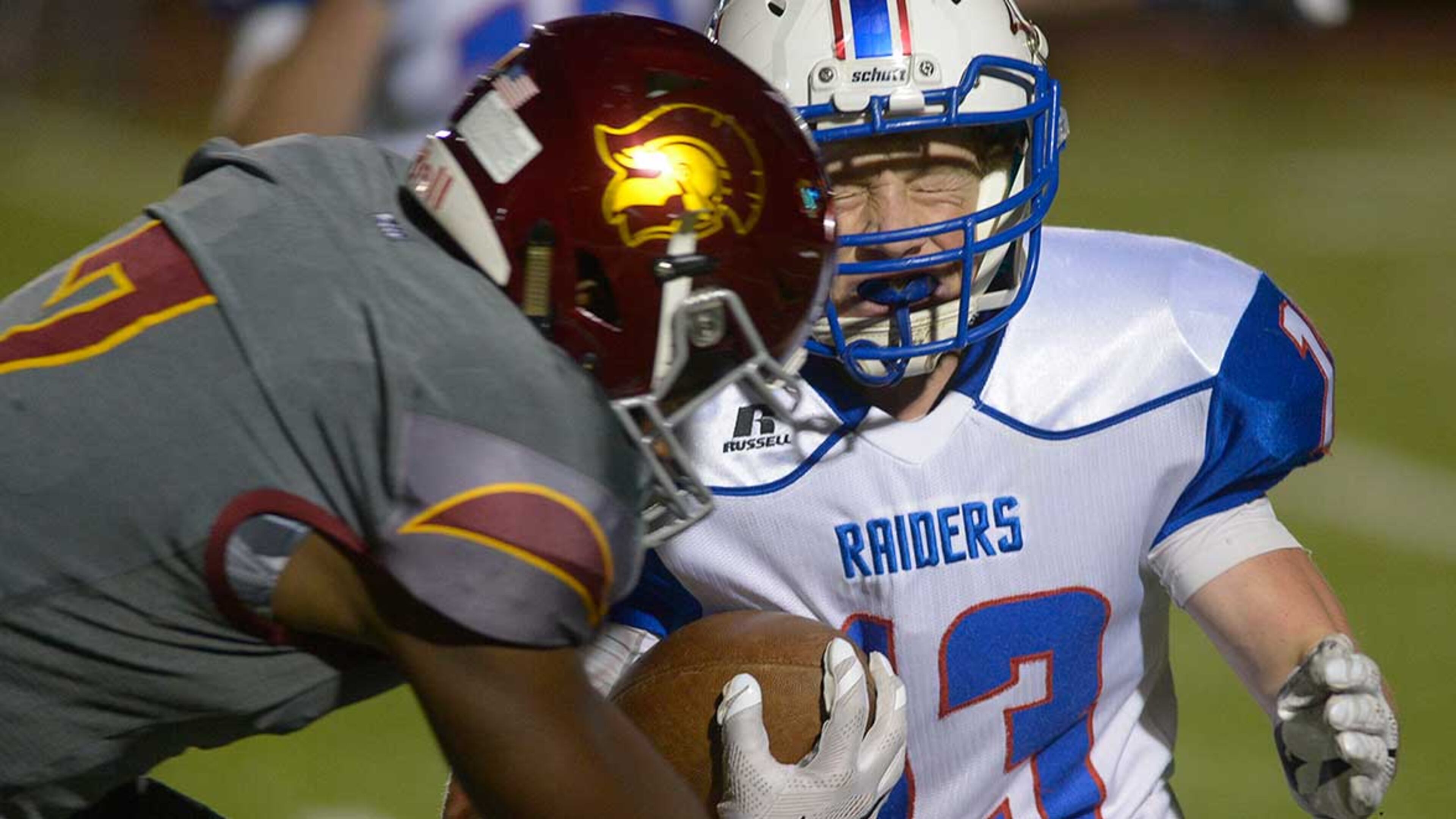 Walton junior WR Chandler Smith (13) braces for a hit from Lassiter junior CB Derrik Allen (7) during the second half of Friday's game.
