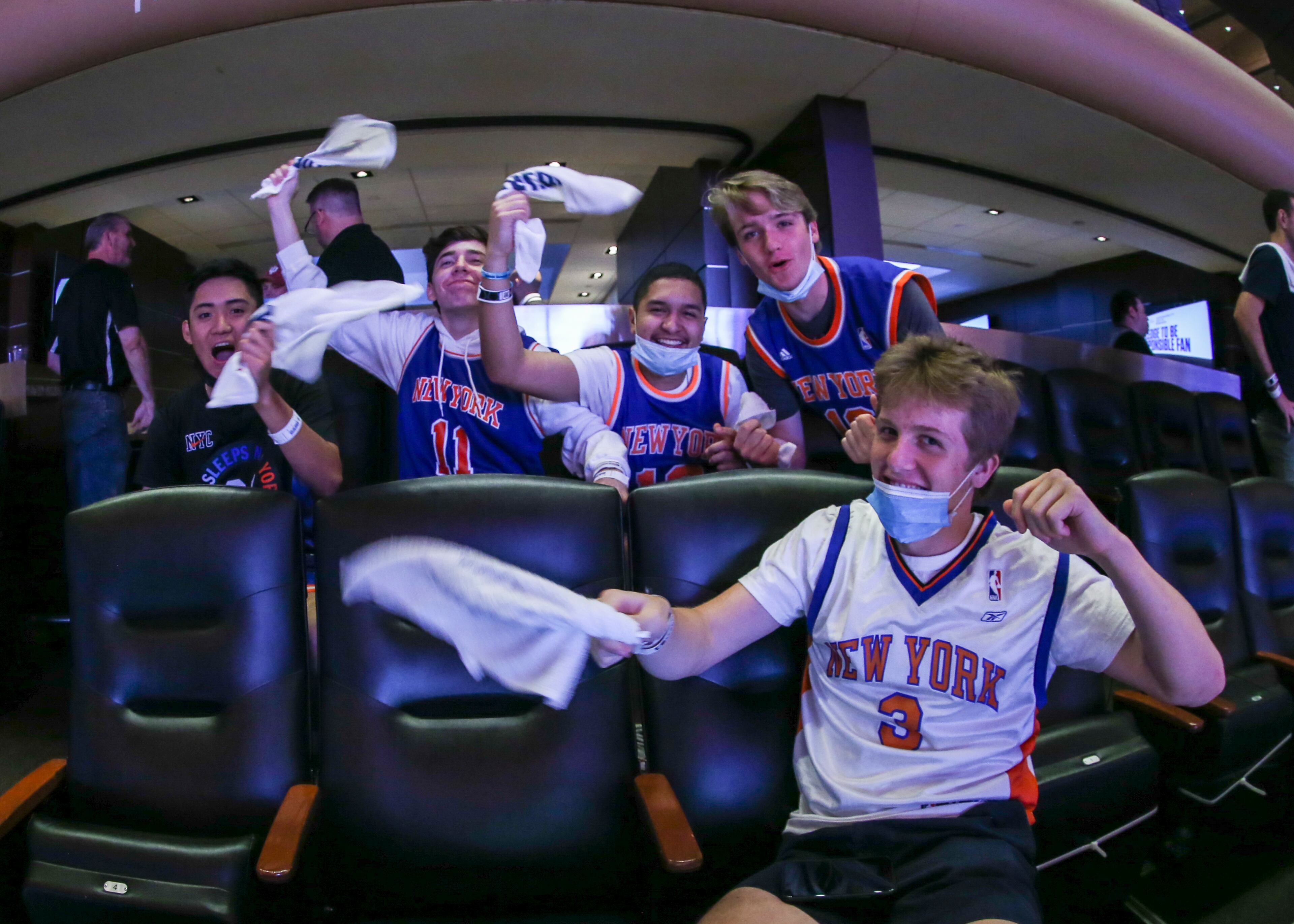 New York Knicks fans cheer before Game 5 of an NBA basketball first-round playoff series between the Knicks and the Atlanta Hawks on Wednesday, June 2, 2021, in New York. (Wendell Cruz/Pool Photo via AP)