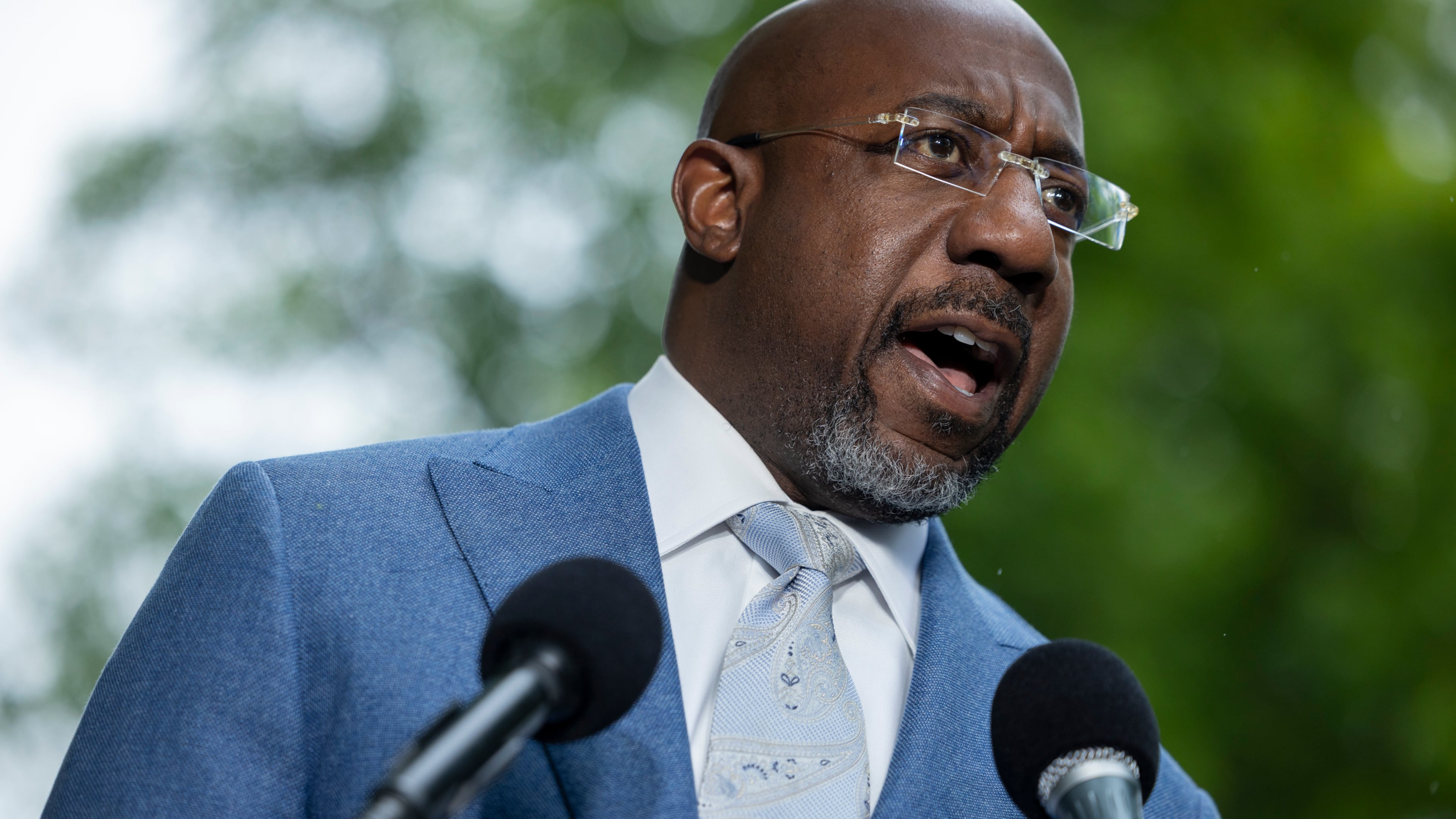 U.S. Sen. Raphael Warnock speaks at a news conference on the Voting Right’s Act, across the street from the U.S. Supreme Court, in Washington, April 2026. (Nathan Posner for the AJC)