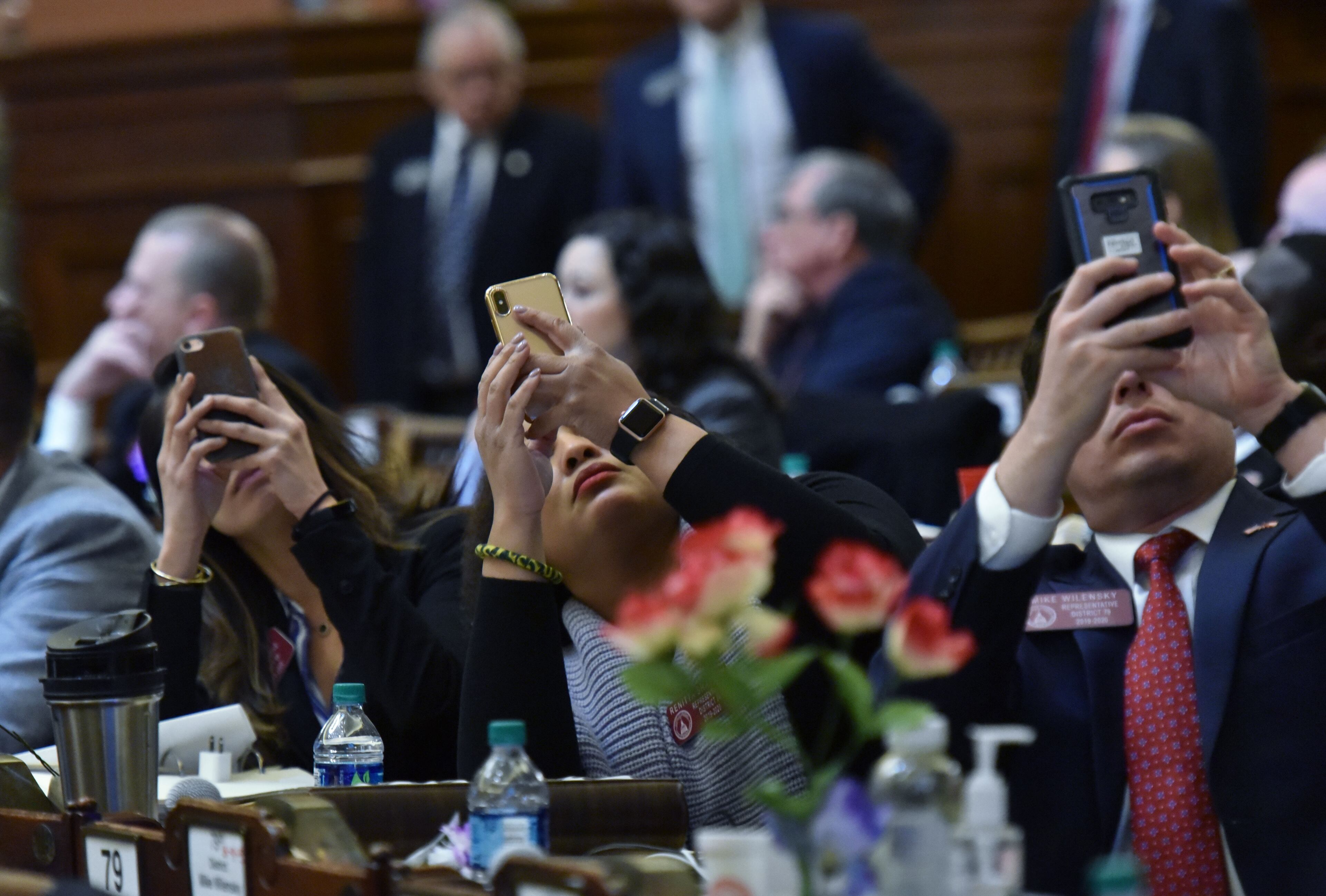March 7, 2019 Atlanta - Representatives (from left) Bee Nguyen, Renitta Shannon and Mike Wilensky take pictures of the result as they vote on HB 481, which would outlaw abortions once a doctor can detect a heartbeat in the womb, in the House Chambers during Crossover day at the Capitol on Thursday, March 7, 2019. Hundreds of bills hang in the balance at the Georgia Capitol on Thursday, the self-imposed deadline for legislation to pass at least one chamber. Dozens of bills ranging from the hotly contested to the mundane will be debated on Crossover Day, which occurs on the 28th business day of each year's 40-day legislative session. HYOSUB SHIN / HSHIN@AJC.COM