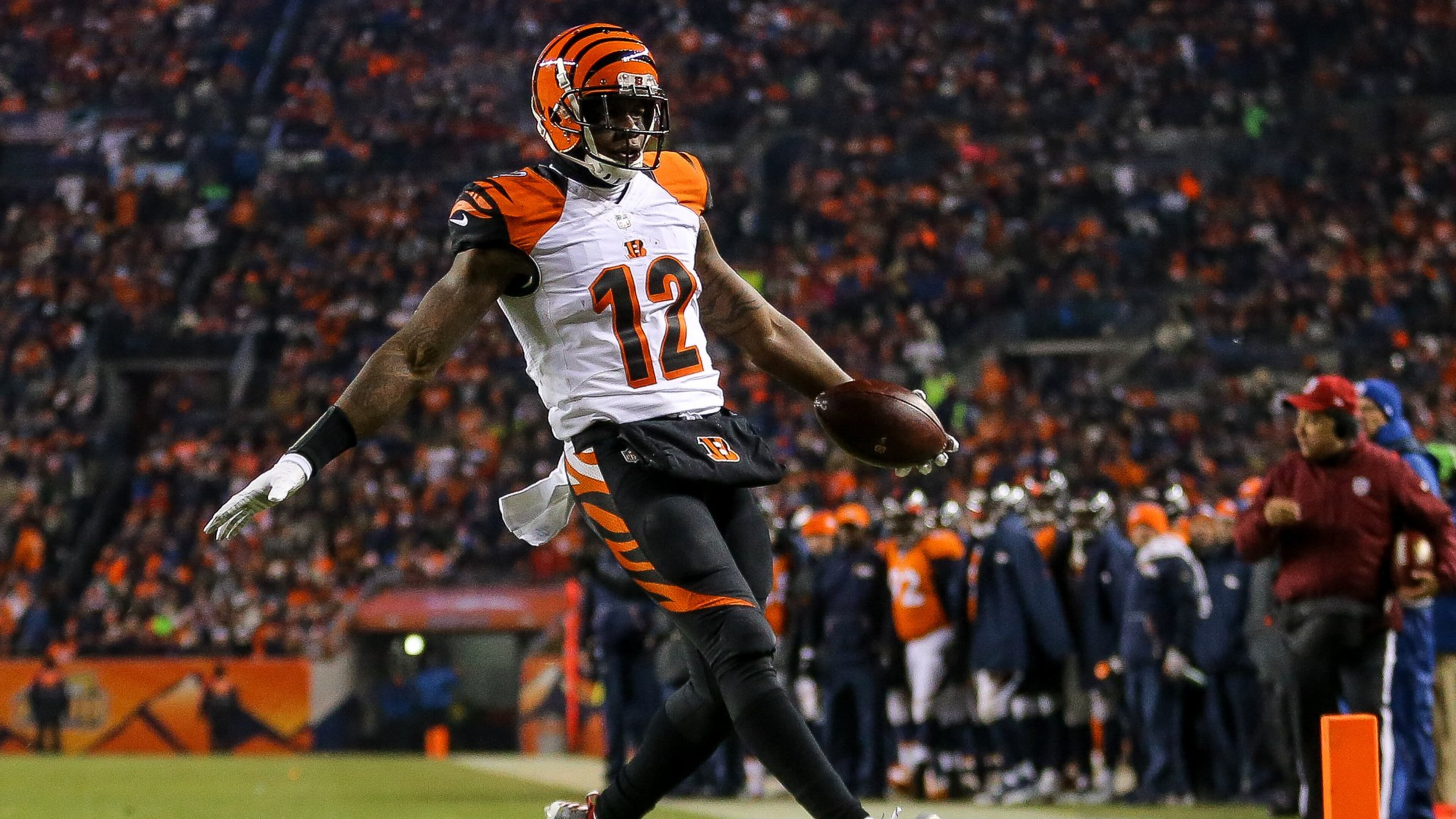 DENVER, CO - DECEMBER 28: Wide receiver Mohamed Sanu #12 of the Cincinnati Bengals rushes for a touchdown after taking a direct snap at the 6-yard line in the second quarter of a game against the Denver Broncos at Sports Authority Field at Mile High on December 28, 2015 in Denver, Colorado. (Photo by Justin Edmonds/Getty Images)