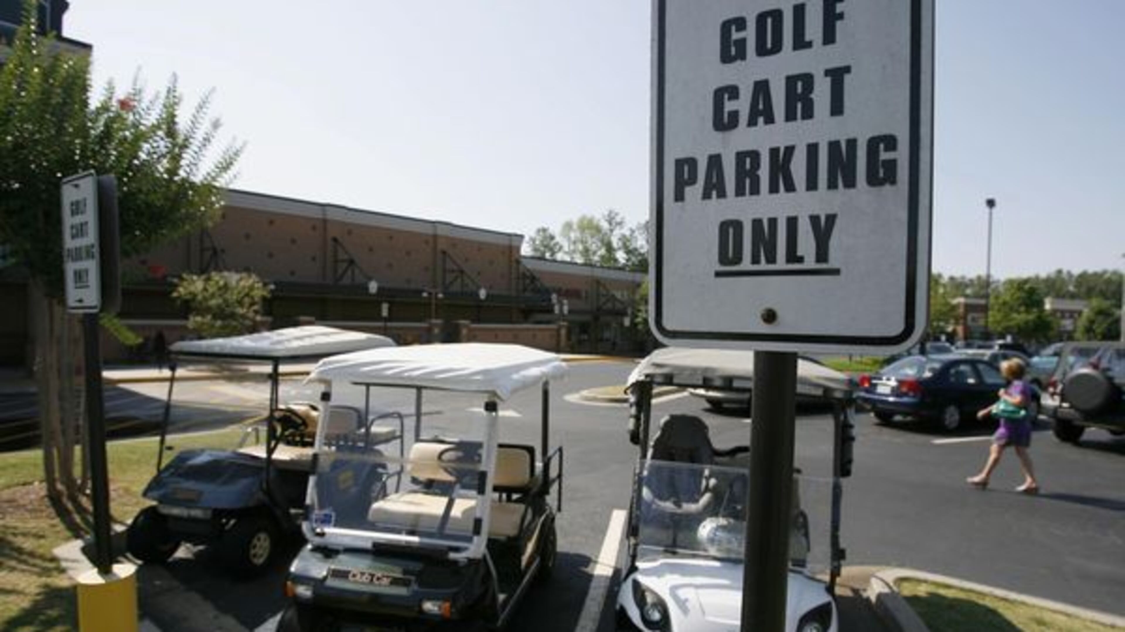 Like their neighbors in Peachtree City, Lilburn is encouraging residents to visit Old Town via golf cart. AJC file photo