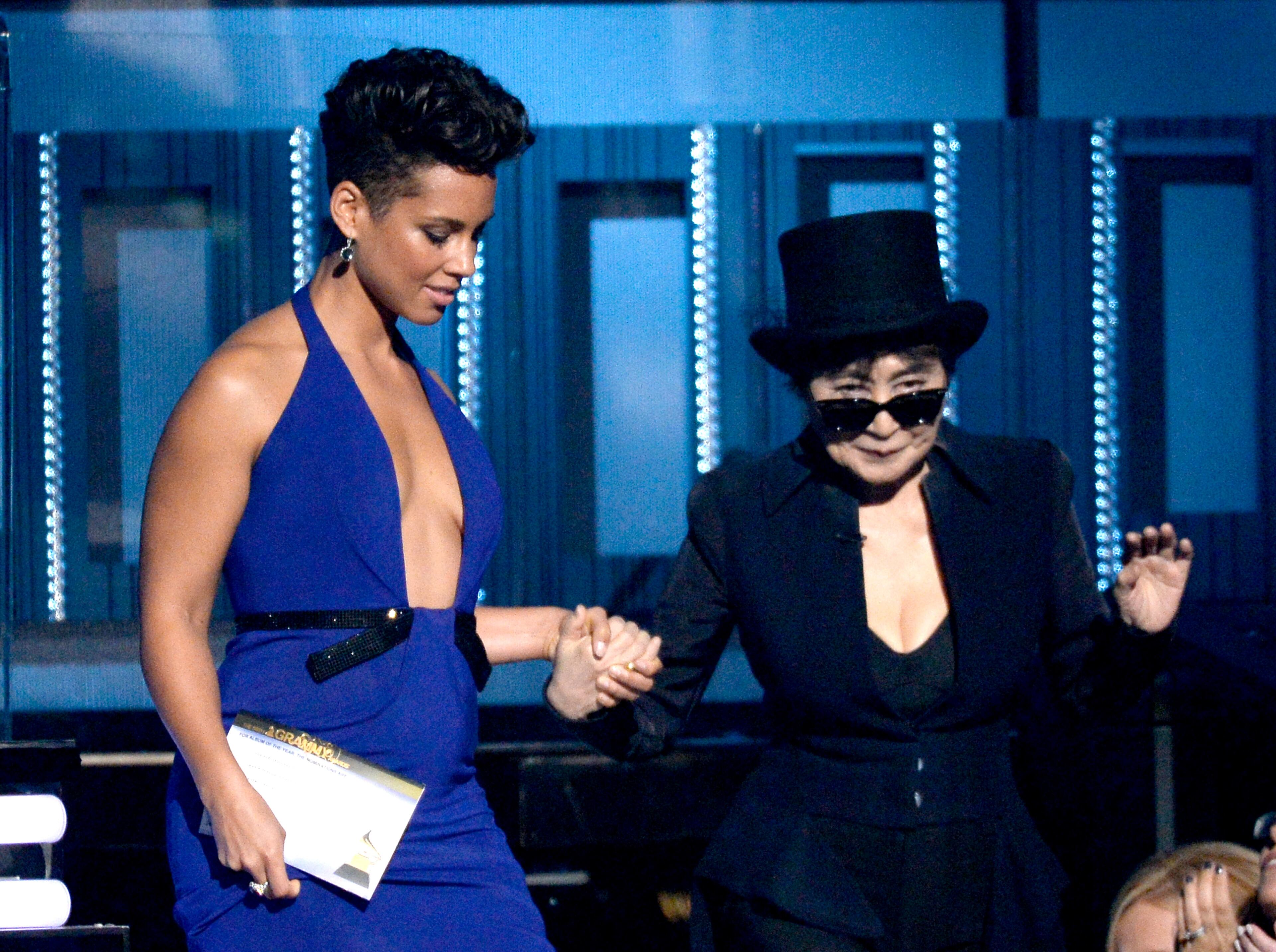 LOS ANGELES, CA - JANUARY 26: Musicians Alicia Keys (L) and Yoko Ono speak onstage during the 56th GRAMMY Awards at Staples Center on January 26, 2014 in Los Angeles, California. (Photo by Kevork Djansezian/Getty Images)