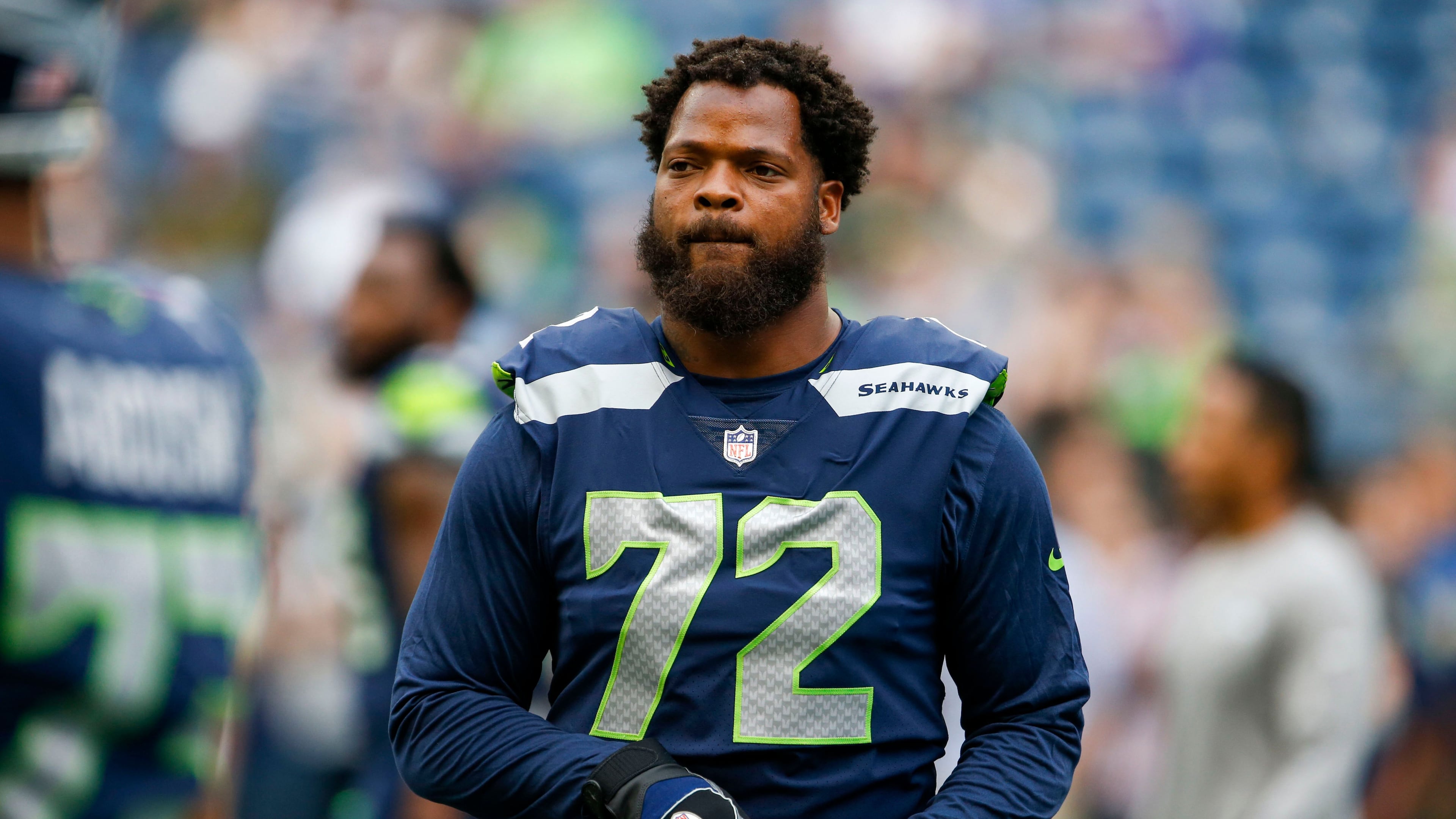 Seattle Seahawks defensive end Michael Bennett (72) participates in pregame warmups against the Minnesota Vikings at CenturyLink Field.